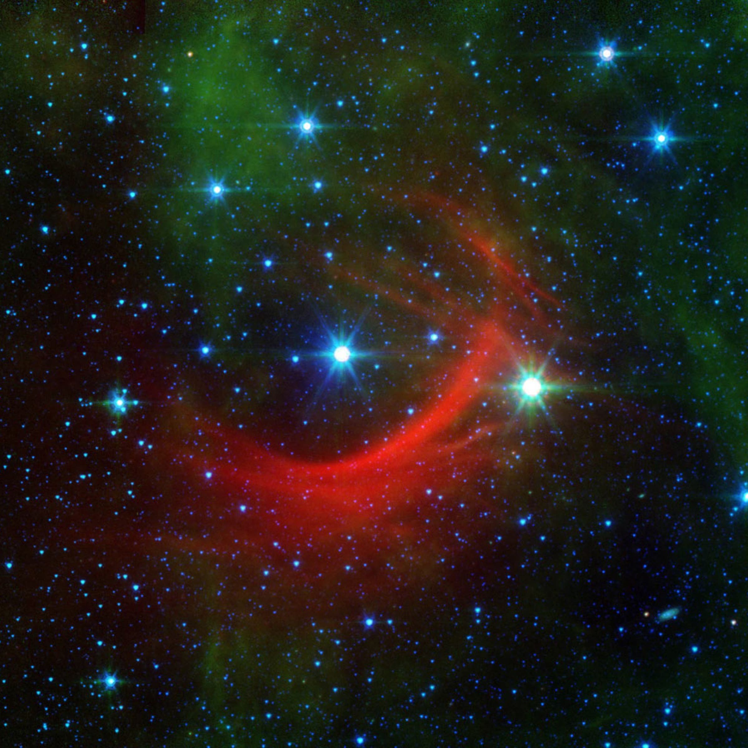 The Kappa Cassiopeiae star, or the HD 2905, taken from NASA's Spitzer Space Telescope (SST), released on Feb. 22, 2014. Kappa Cassiopeiae is a massive, hot supergiant moving at around 2.5 million mph relative to its neighbors (1,100 km per second). The surrounding red streaks of material in its path are called bow shocks, and they can often be seen in front of the fastest, most massive stars in the galaxy.