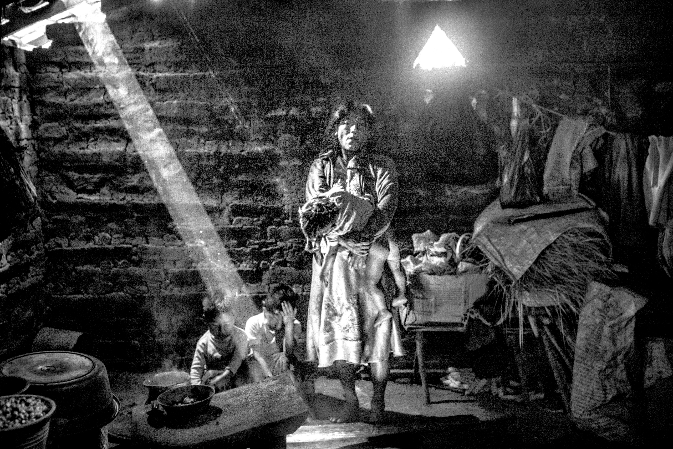 A family in El Chuparosa, Guerrero. When rain poured through their roof, the father said, ÒThe house is crying.Ó