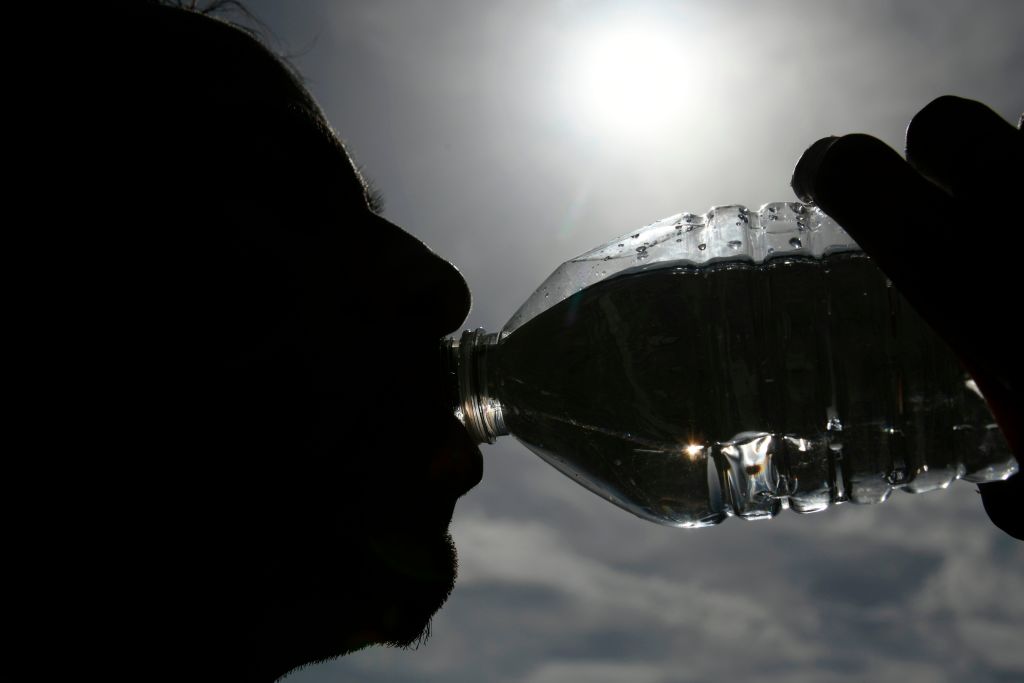 A person drinking a bottle of water