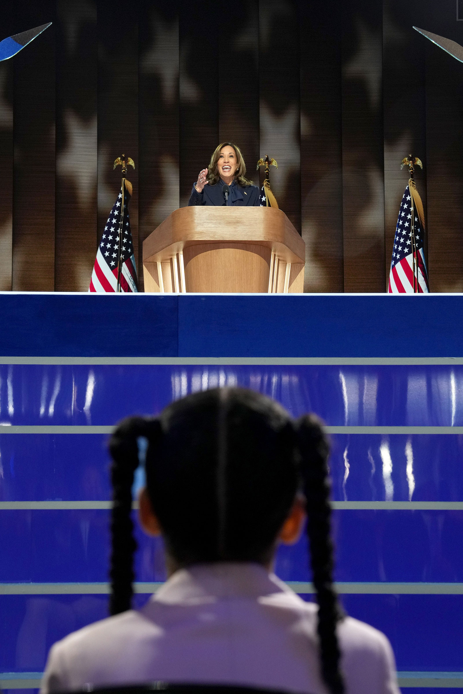 Amara Ajagu watches as Vice President Kamala Harris, the Democratic presidential nominee, speaks on the fourth day of the Democratic National Convention at the United Center in Chicago, on Thursday, Aug. 22, 2024. (Todd Heisler/The New York Times)