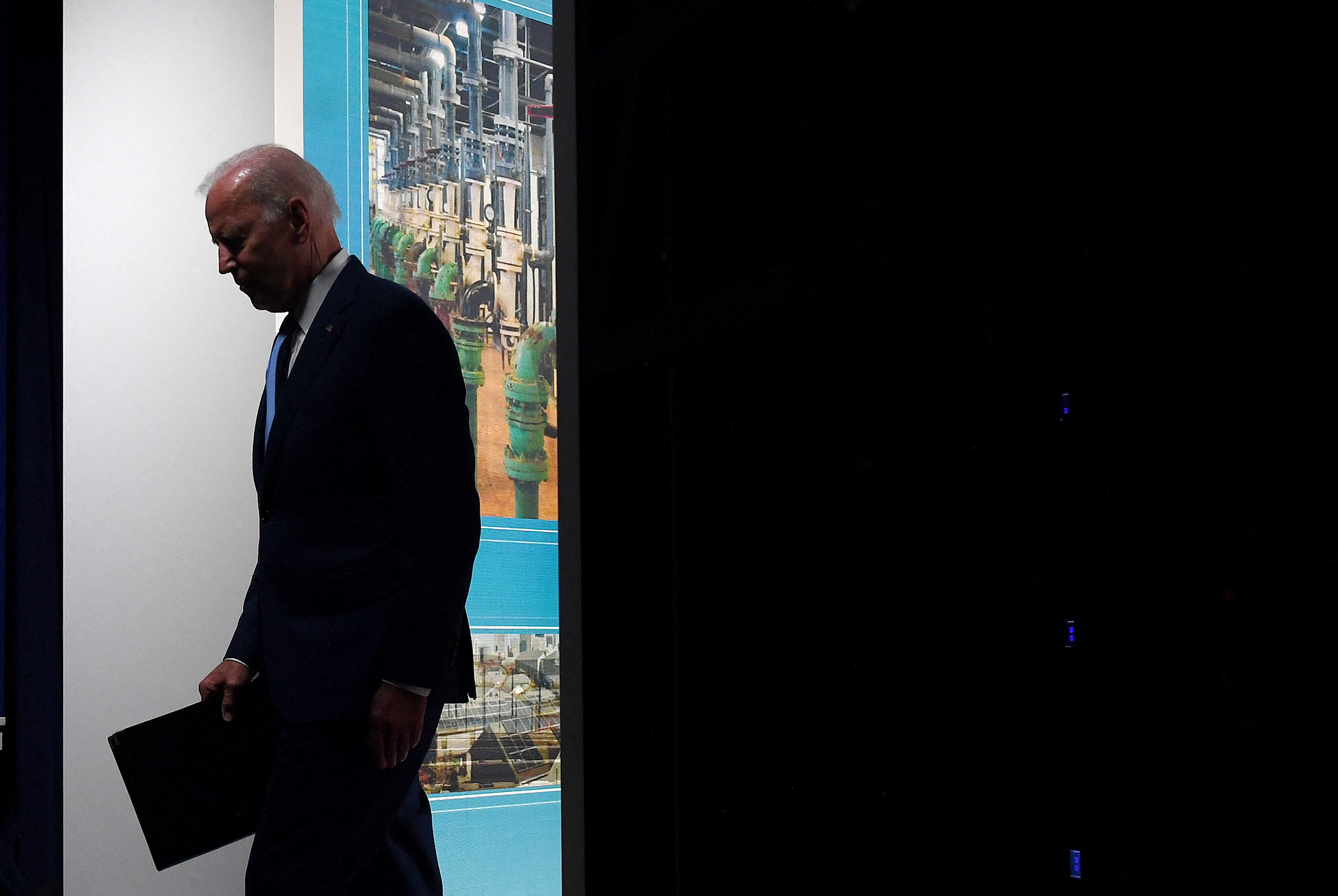 US President Joe Biden leaves after speaking about the September jobs report from the South Court Auditorium at the White House in Washington, DC, on October 8, 2021. 