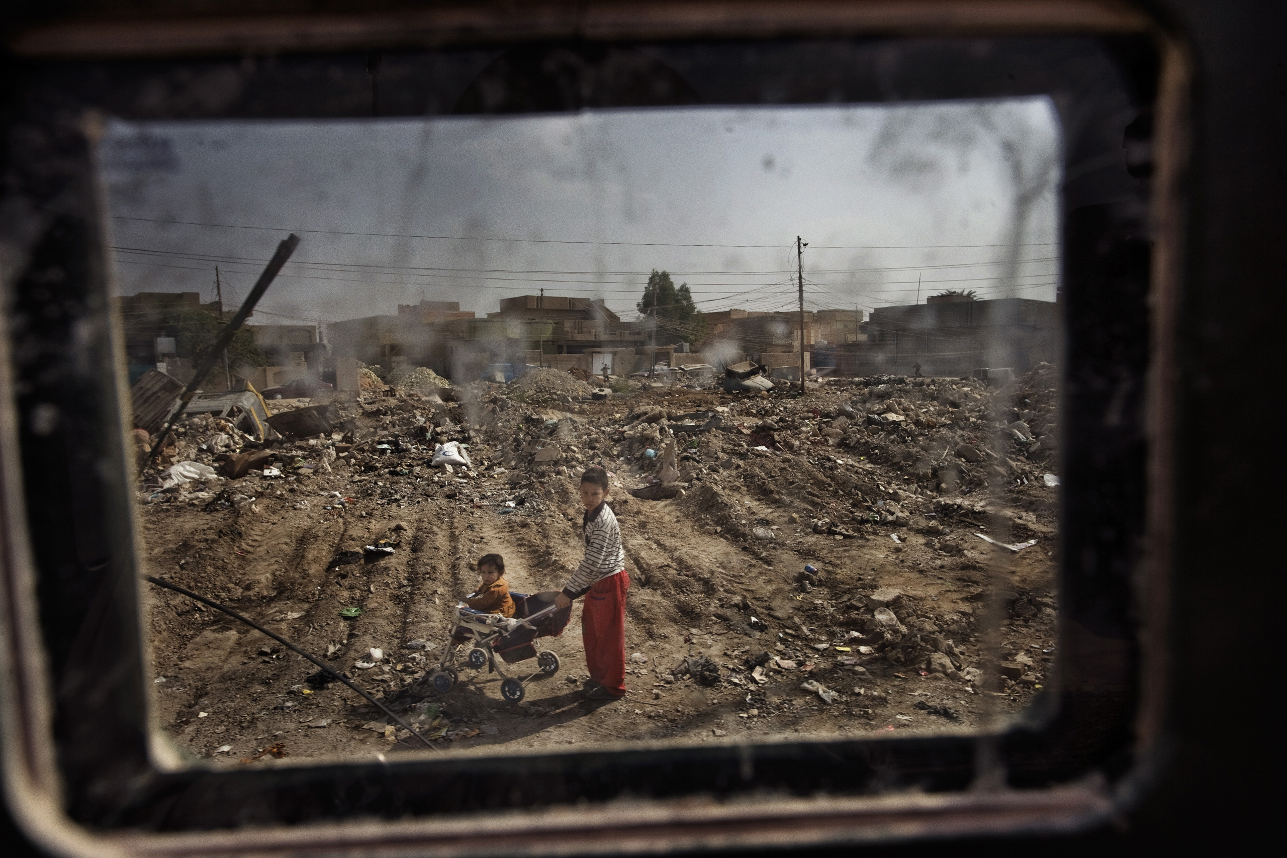 Children seen from a Humvee window in Fallujah, Iraq, Oct. 31, 2005.