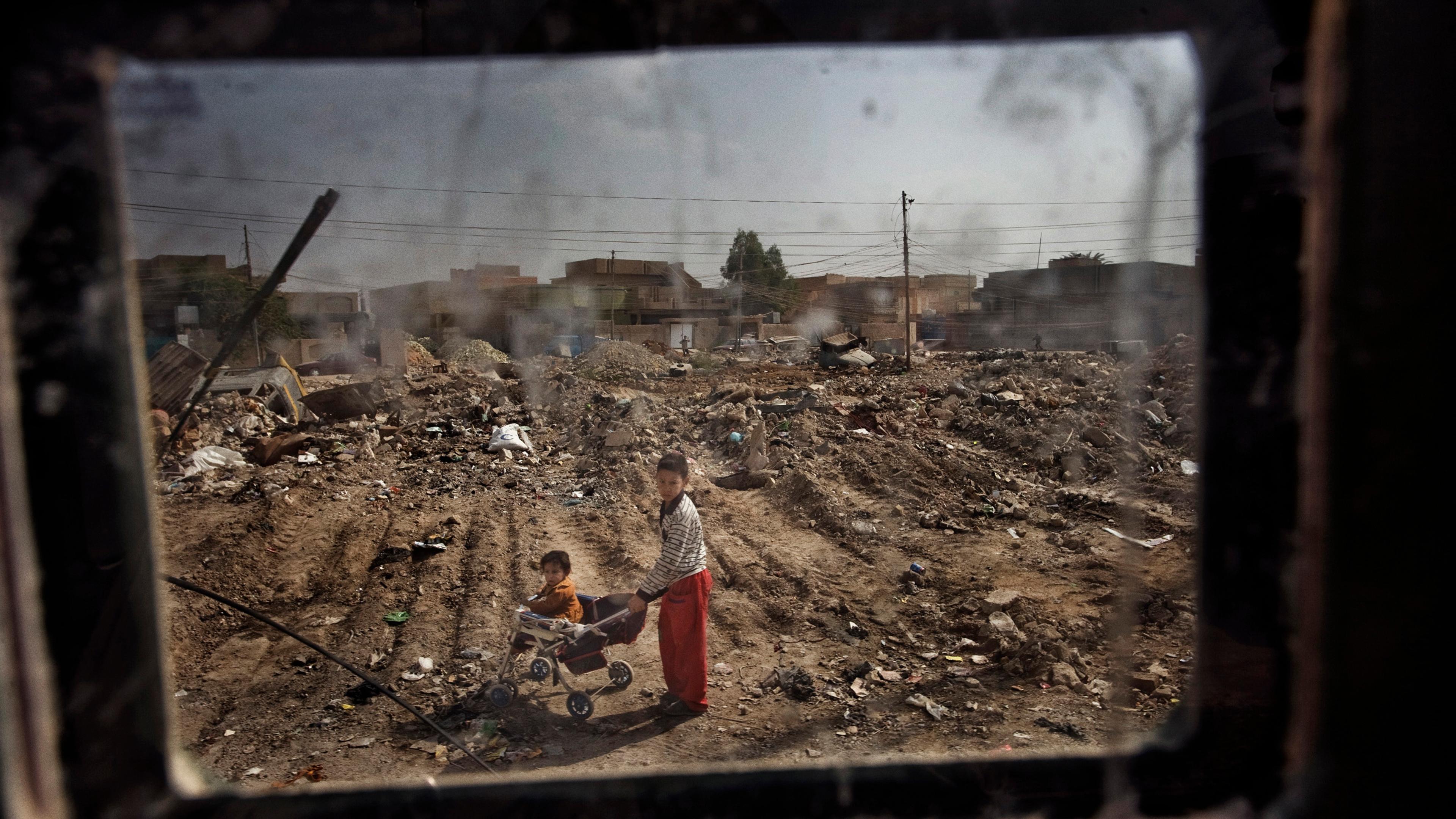 Children seen from a Humvee window in Fallujah, Iraq, Oct. 31, 2005.