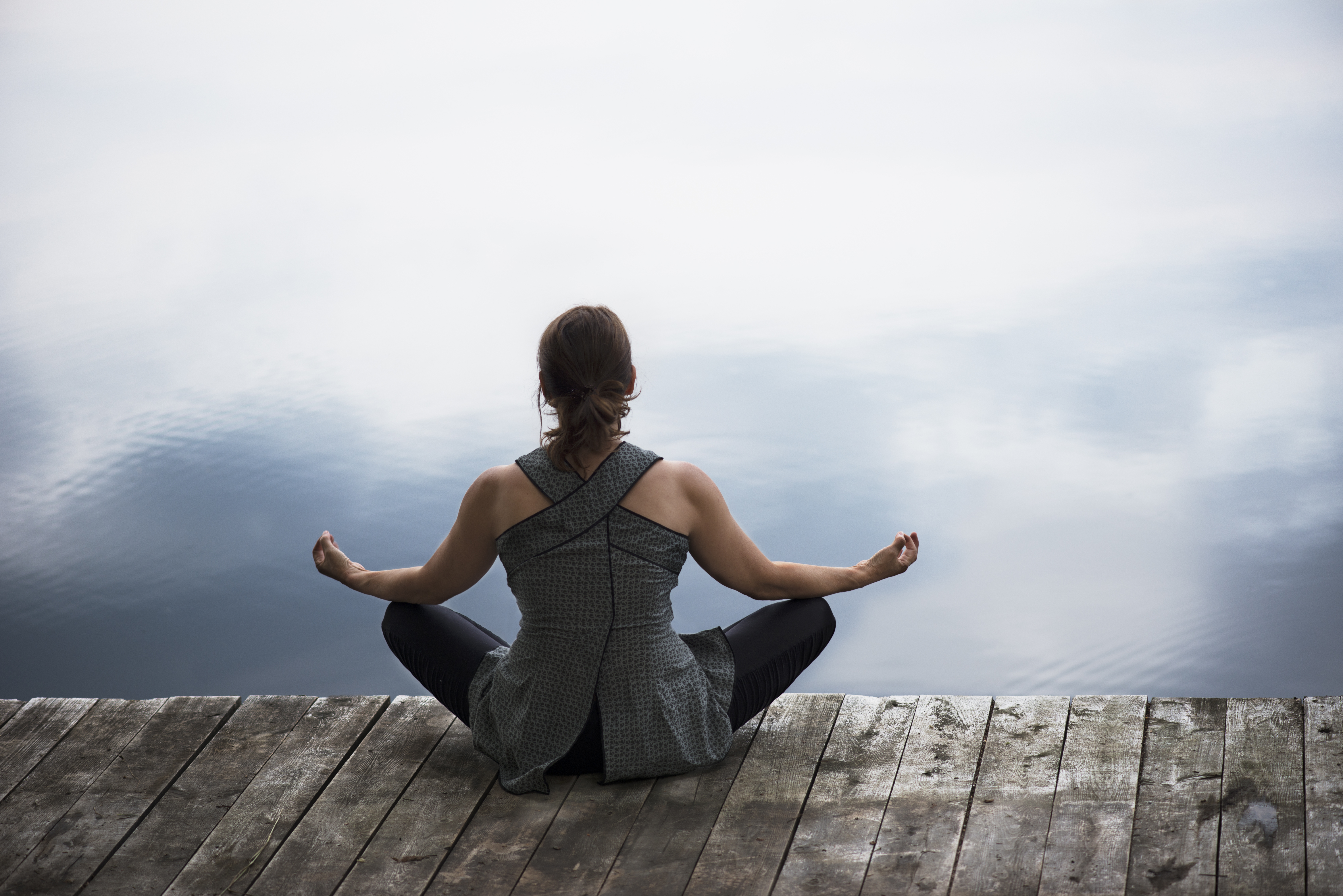Woman doing asana yoga at the end of day