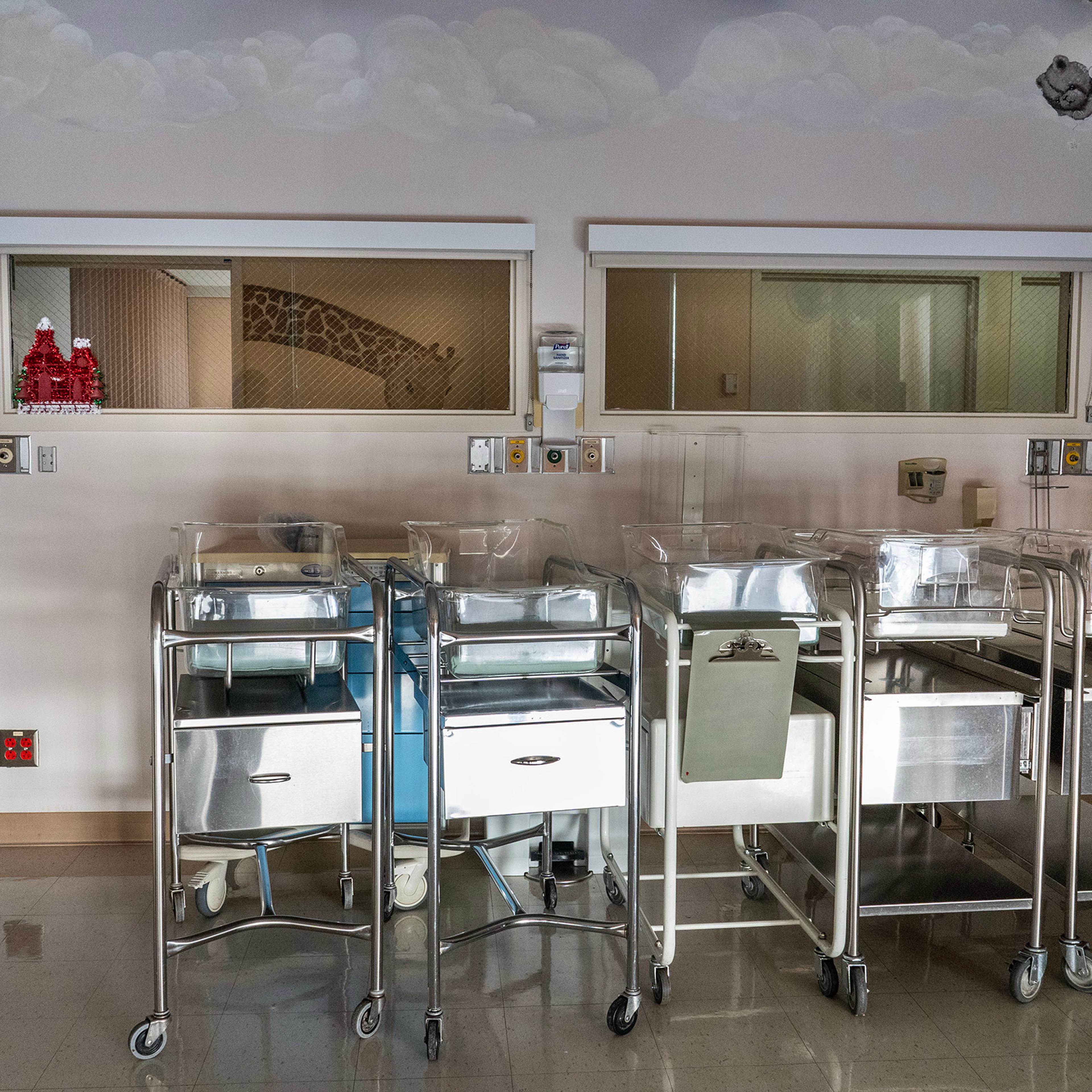 Empty infant beds sit gathered in a corner in an empty maternity ward at Madera Community Hospital in Calif., which closed in January 2023, on Sept. 13, 2023.