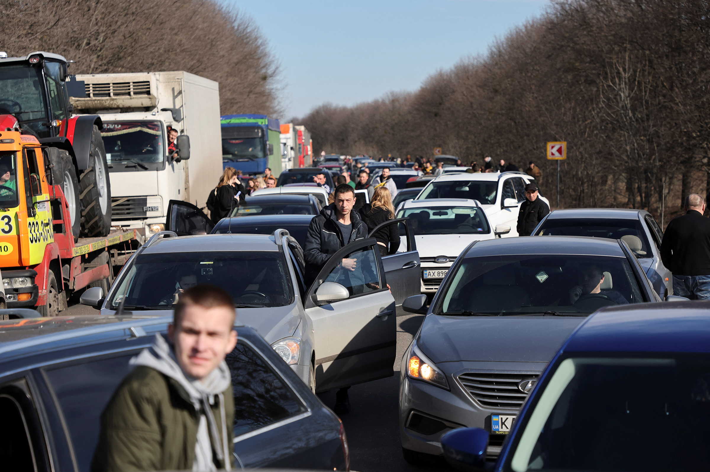 People wait in a traffic jam as they leave the city of Kharkiv, Ukraine, after Russian President Vladimir Putin authorised a military operation in eastern Ukraine, Feb. 24