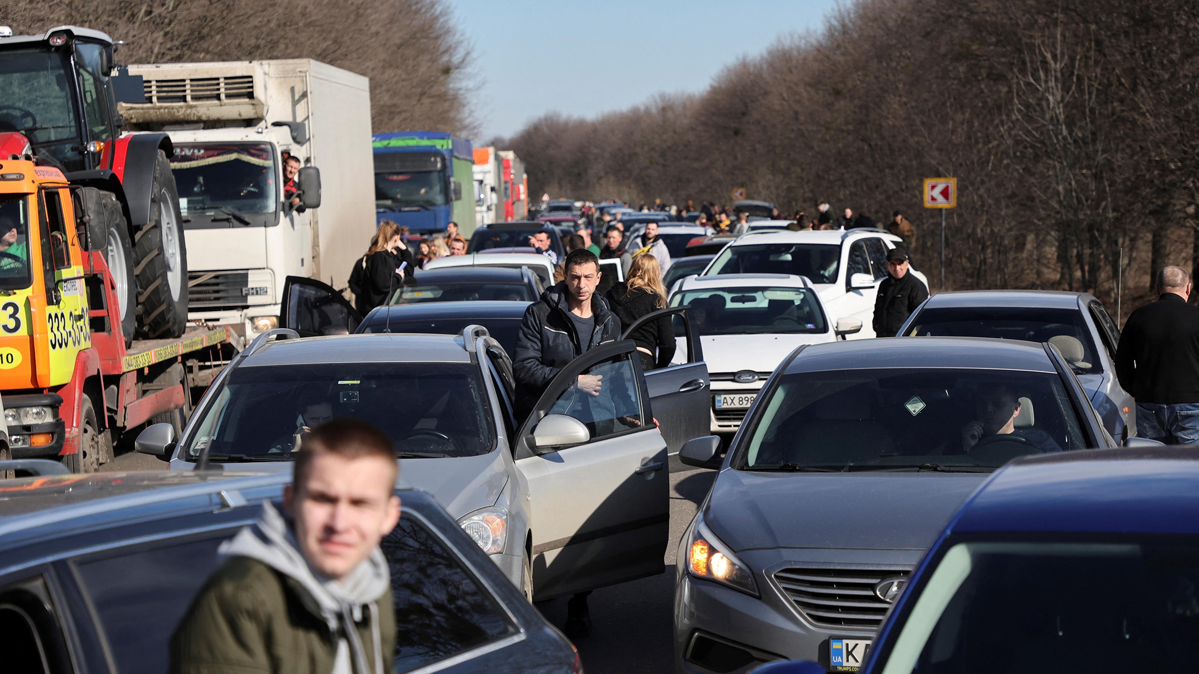 People wait in a traffic jam as they leave the city of Kharkiv, Ukraine, after Russian President Vladimir Putin authorised a military operation in eastern Ukraine, Feb. 24