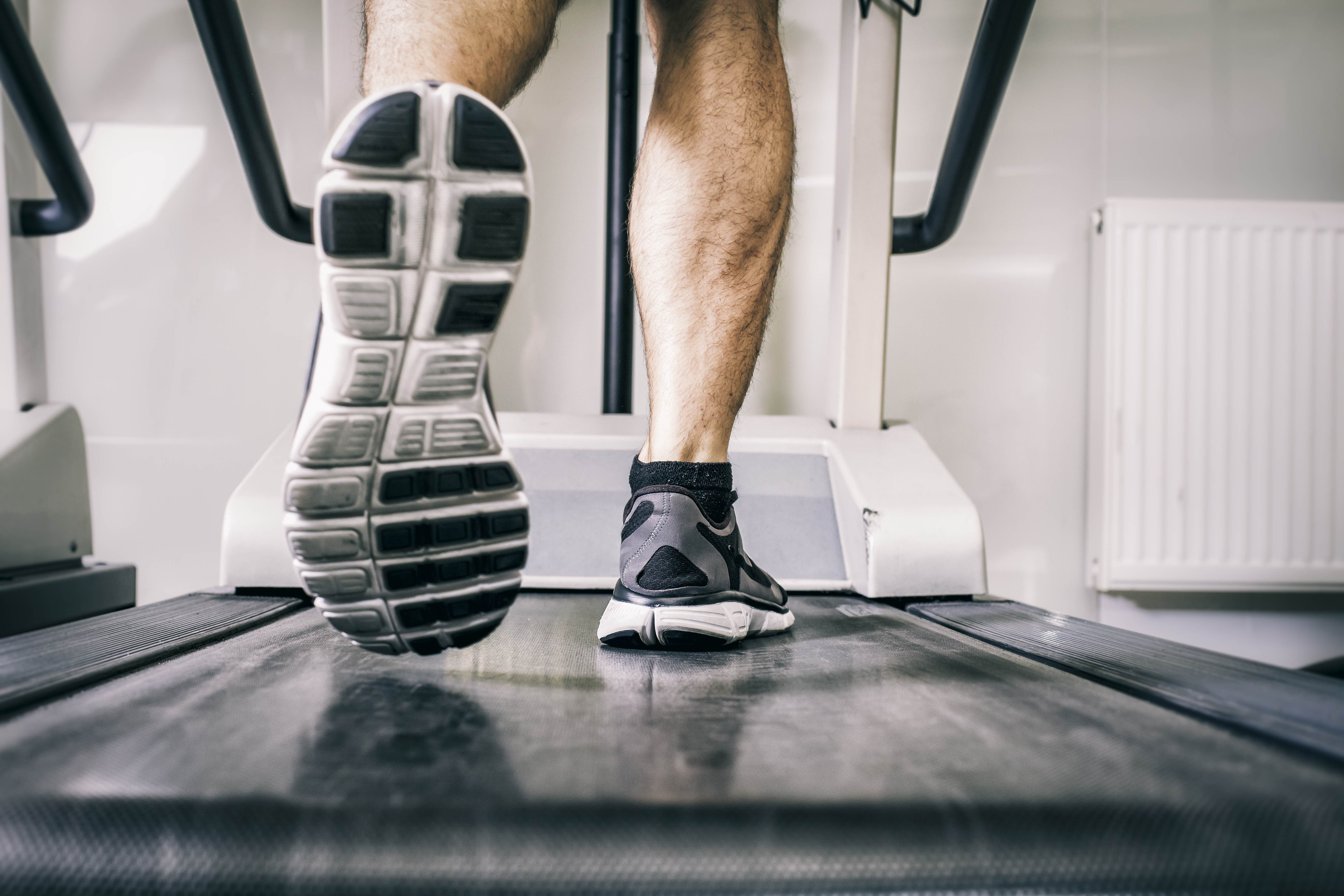 man running on treadmill
