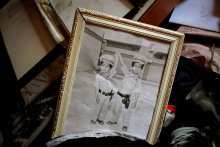 August 26, 2011. A photo of Seif al-Islam and Saadi Gaddafi, the sons of Muammar Gaddafi, is seen in one of the homes within his former compound Bab al-Aziziya in Tripoli, Libya. 
