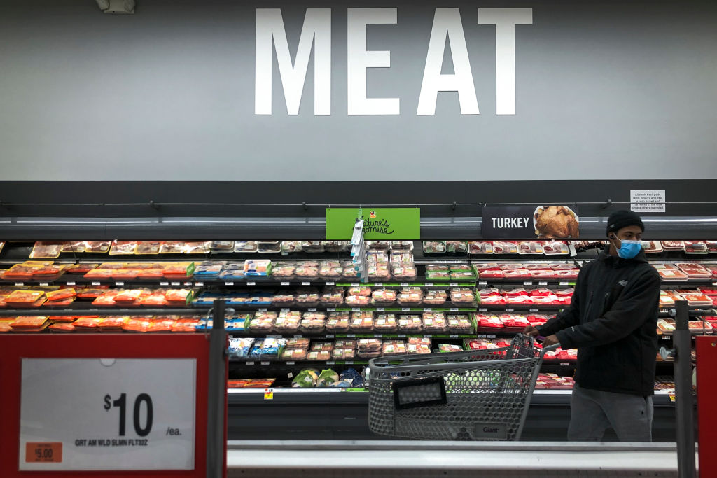A man shops in the meat section at a grocery store, April 28, 2020 ...