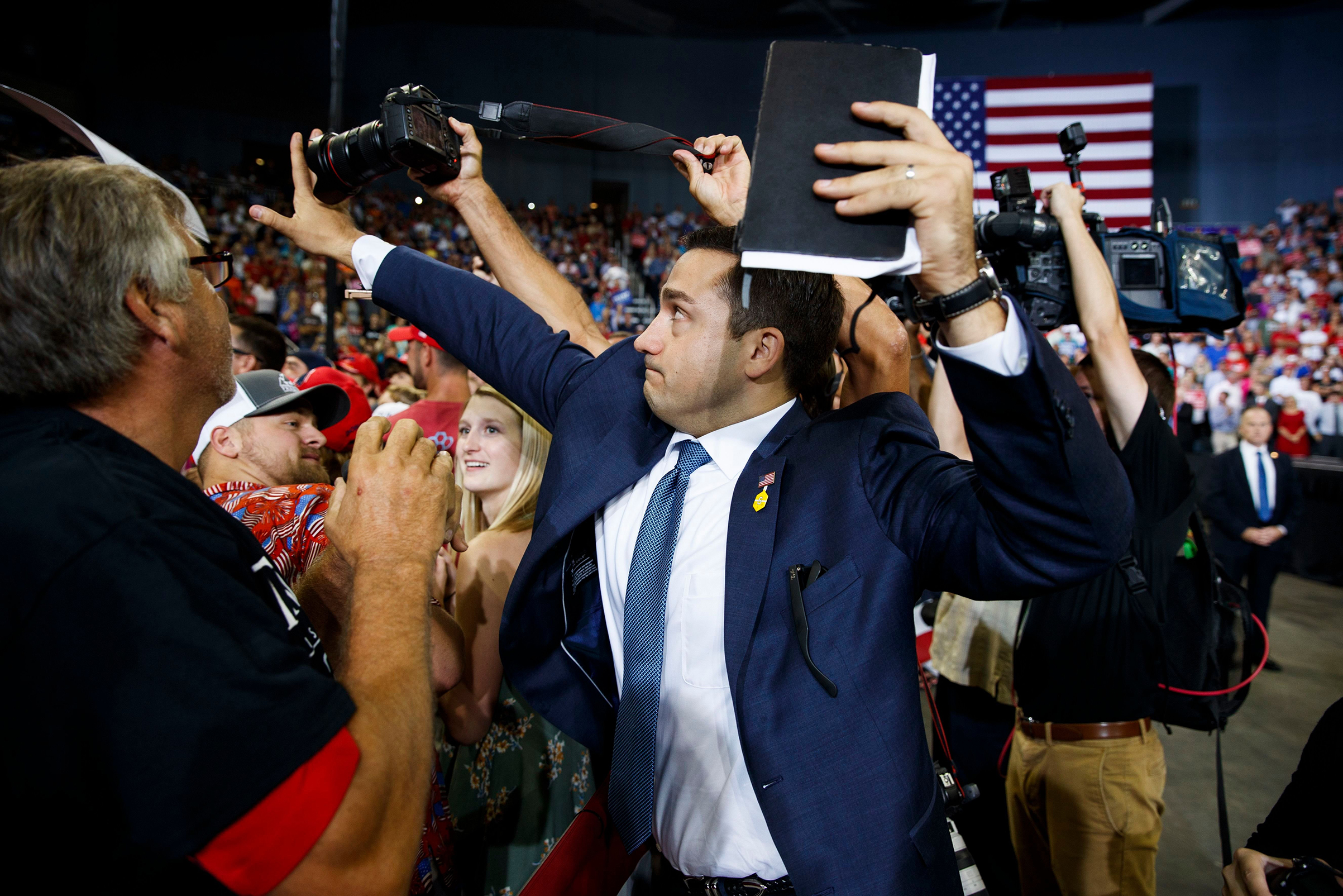 Behind the Photo of a Trump Volunteer Blocking a Camera