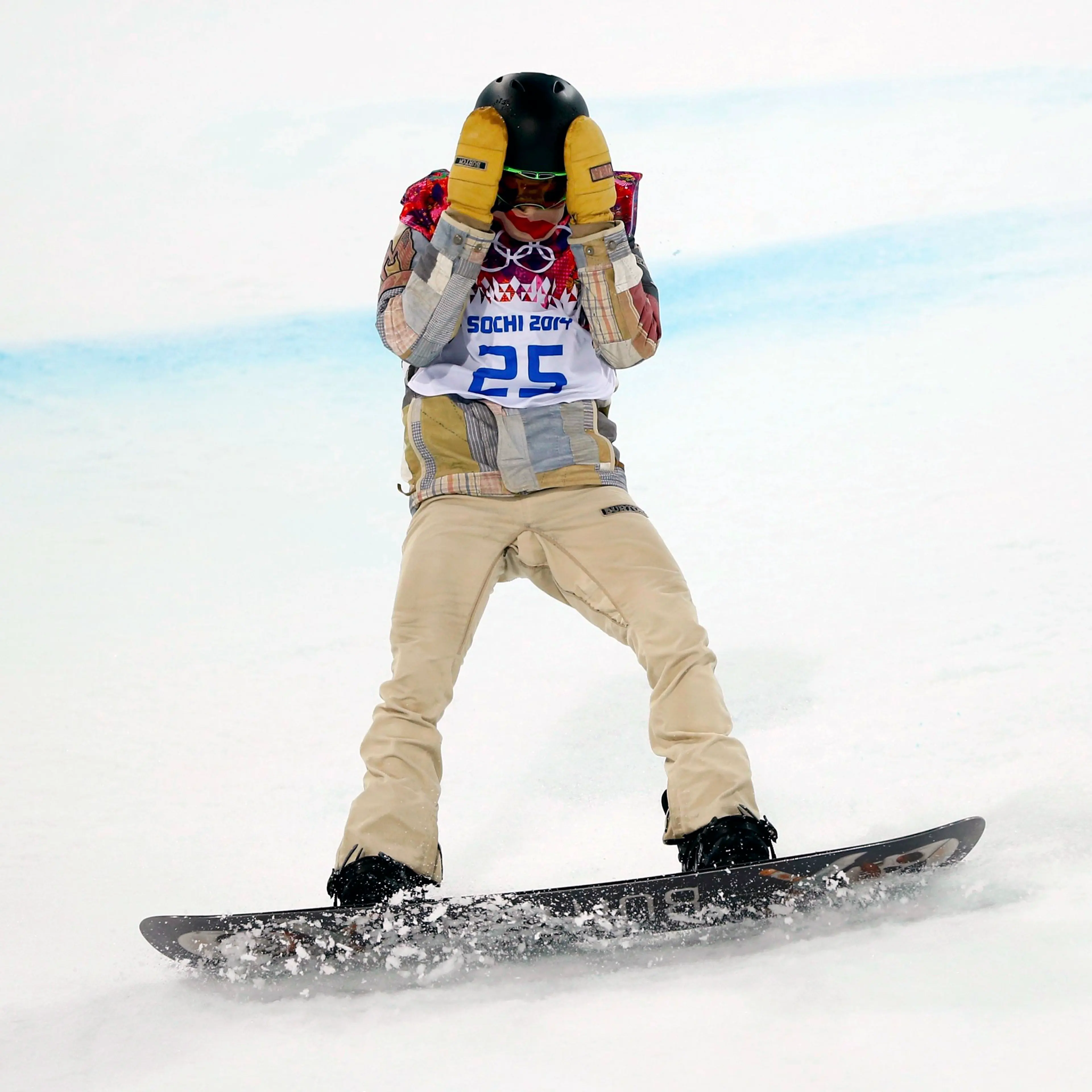 Shaun White of the U.S. reacts after crashing during the men's snowboard halfpipe final event at the 2014 Sochi Winter Olympic Games in Rosa Khutor