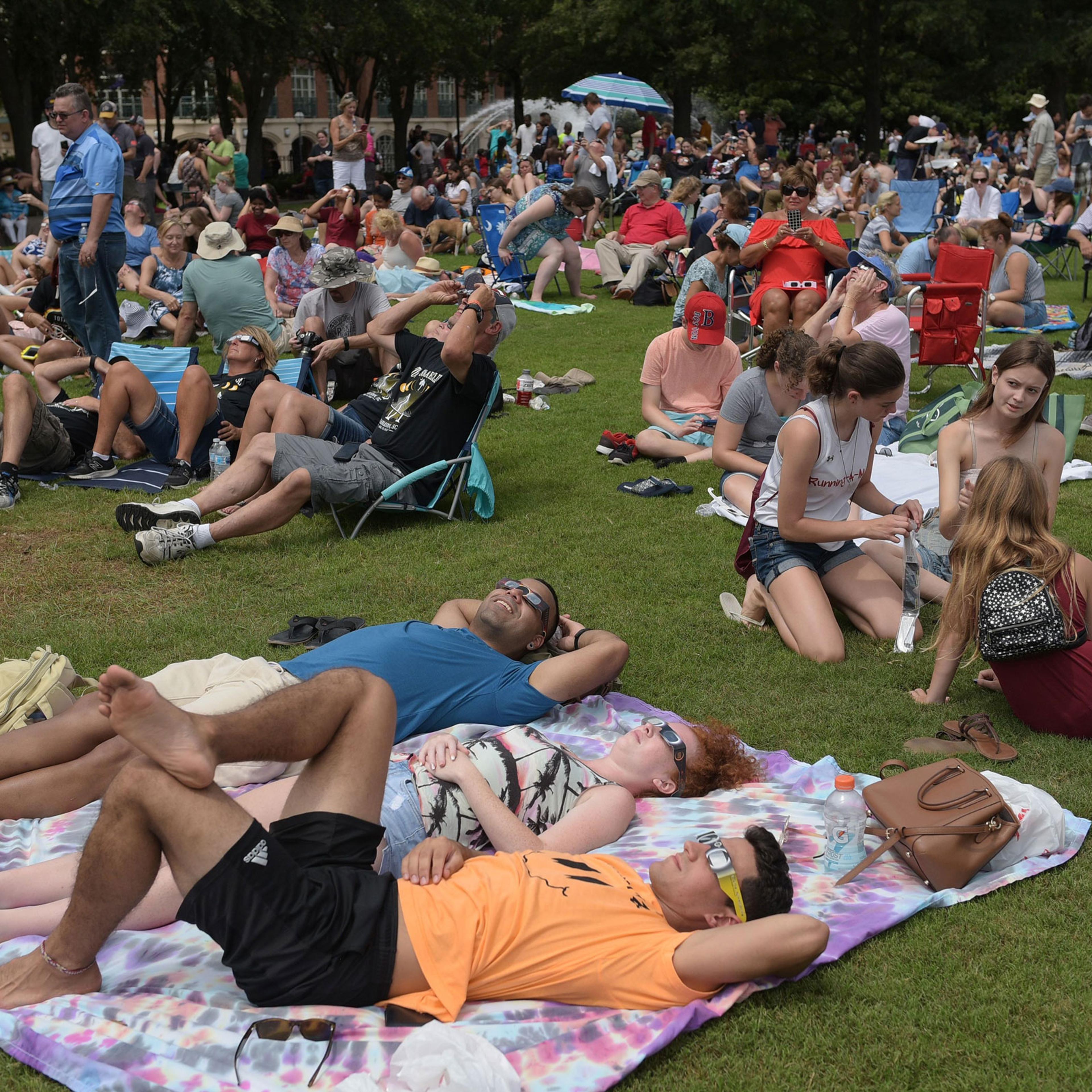 People watch the total solar eclipse in Charleston, South Carolina, on August 21, 2017.