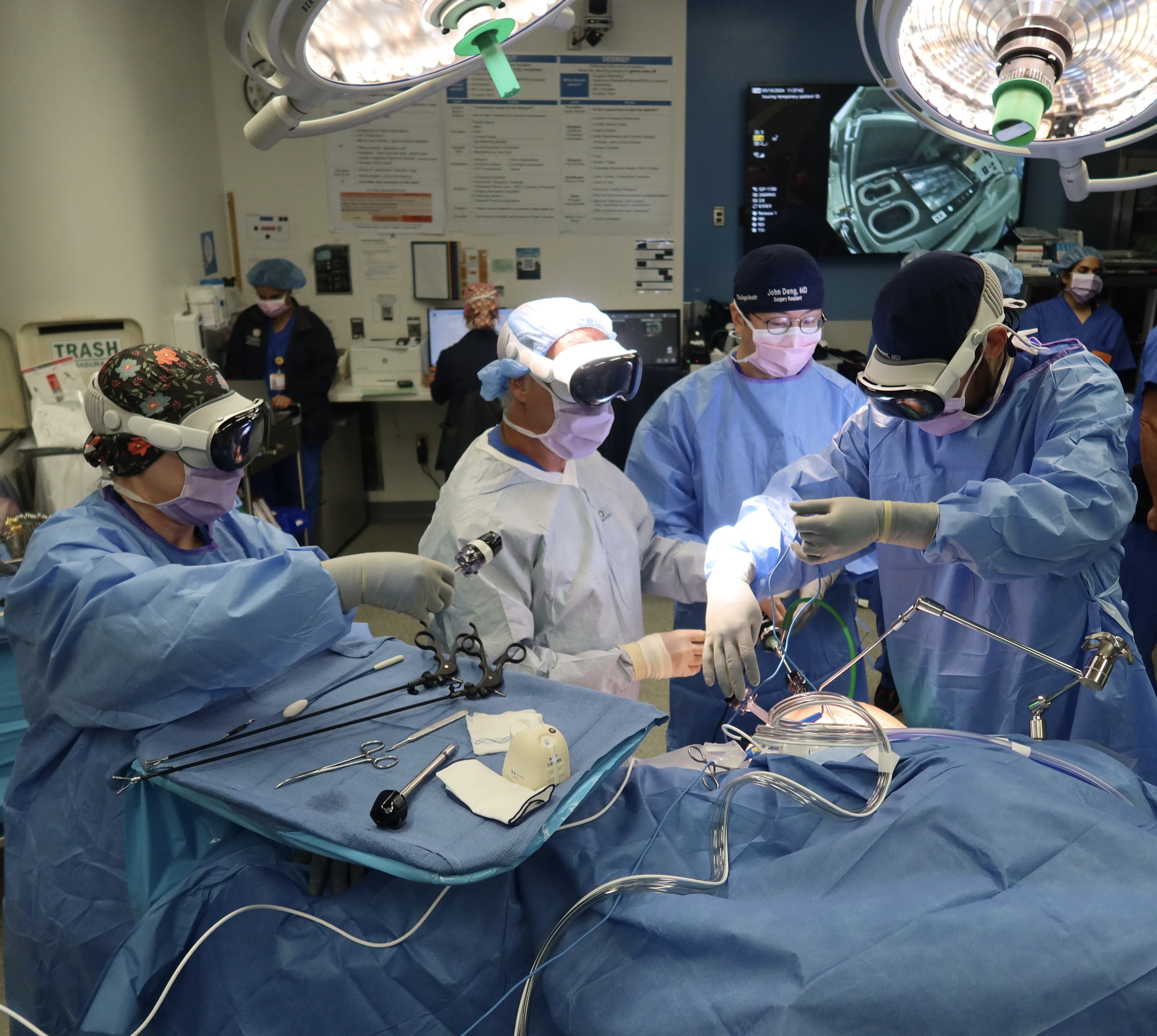Surgeons and nurses wear Apple Vision Pro headsets instead of looking at monitors during surgery at UC San Diego Health. 
