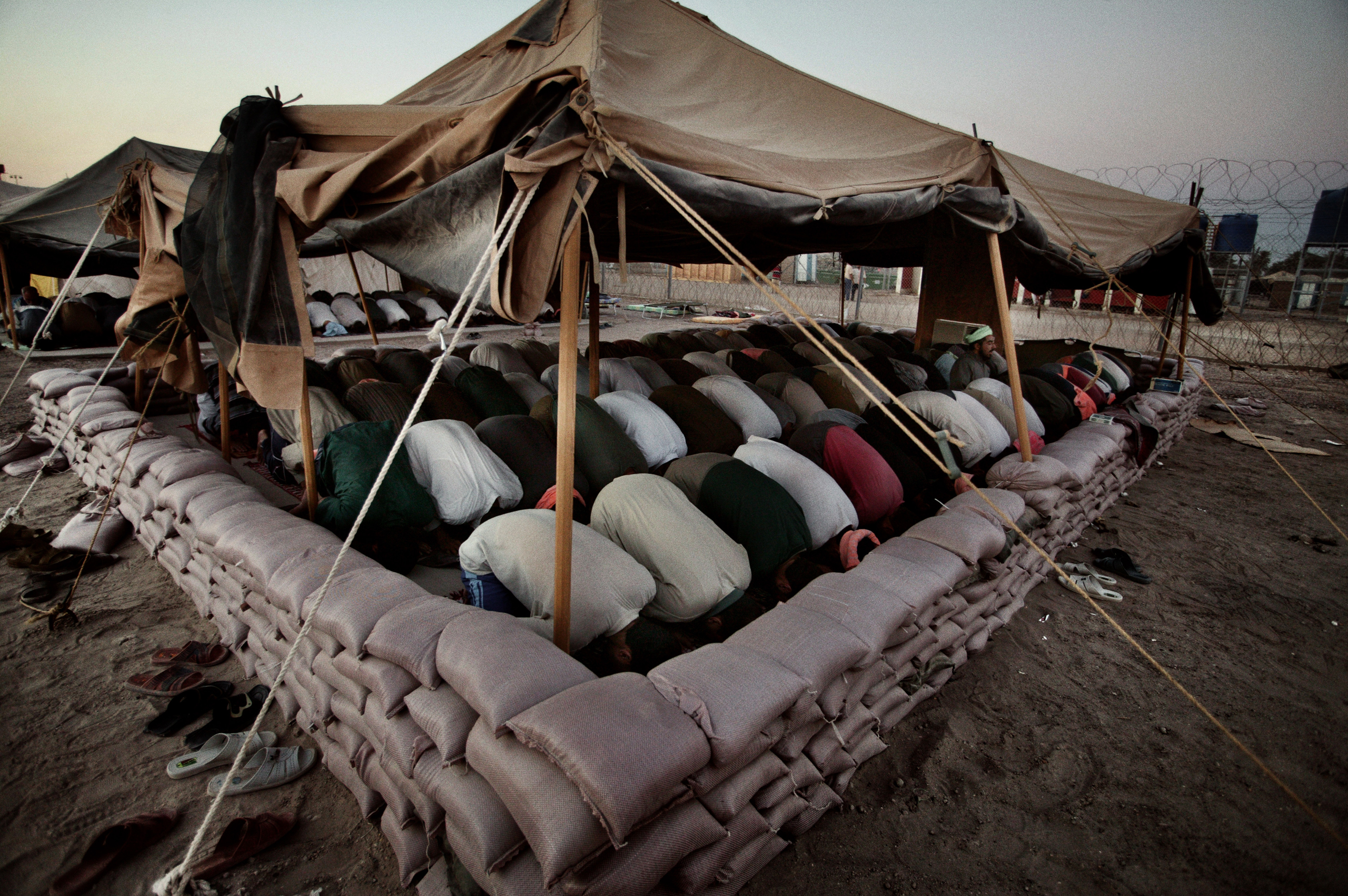 Friday prayer at Abu Ghraib prison on the outskirts of Baghdad, June 25, 2004.