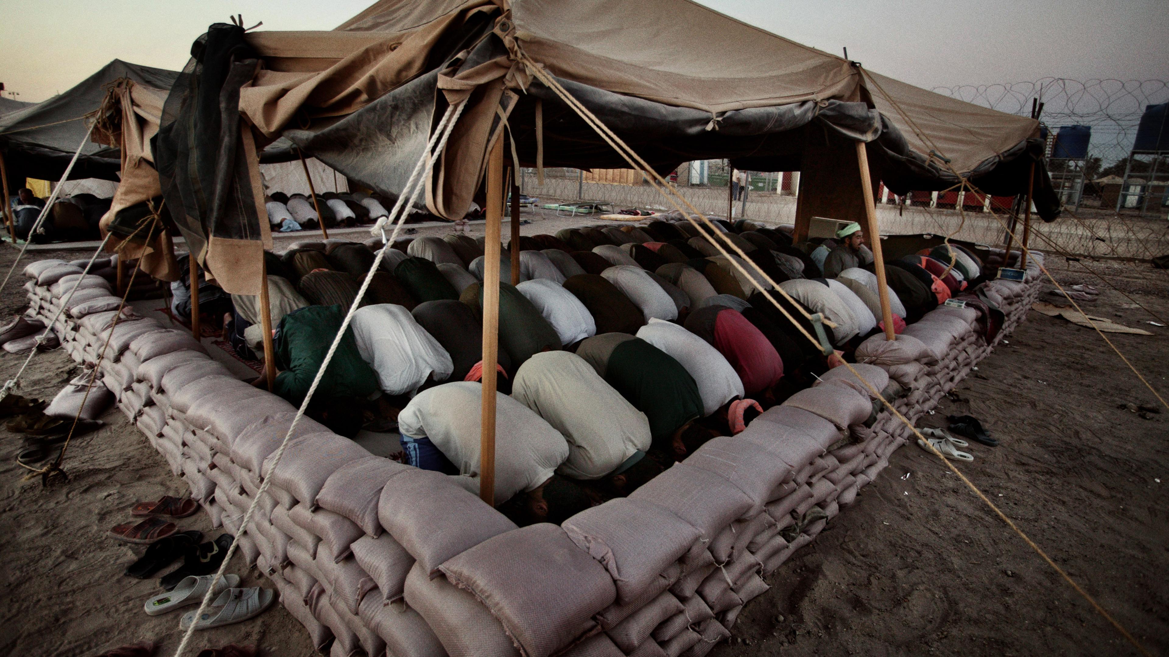 Friday prayer at Abu Ghraib prison on the outskirts of Baghdad, June 25, 2004.