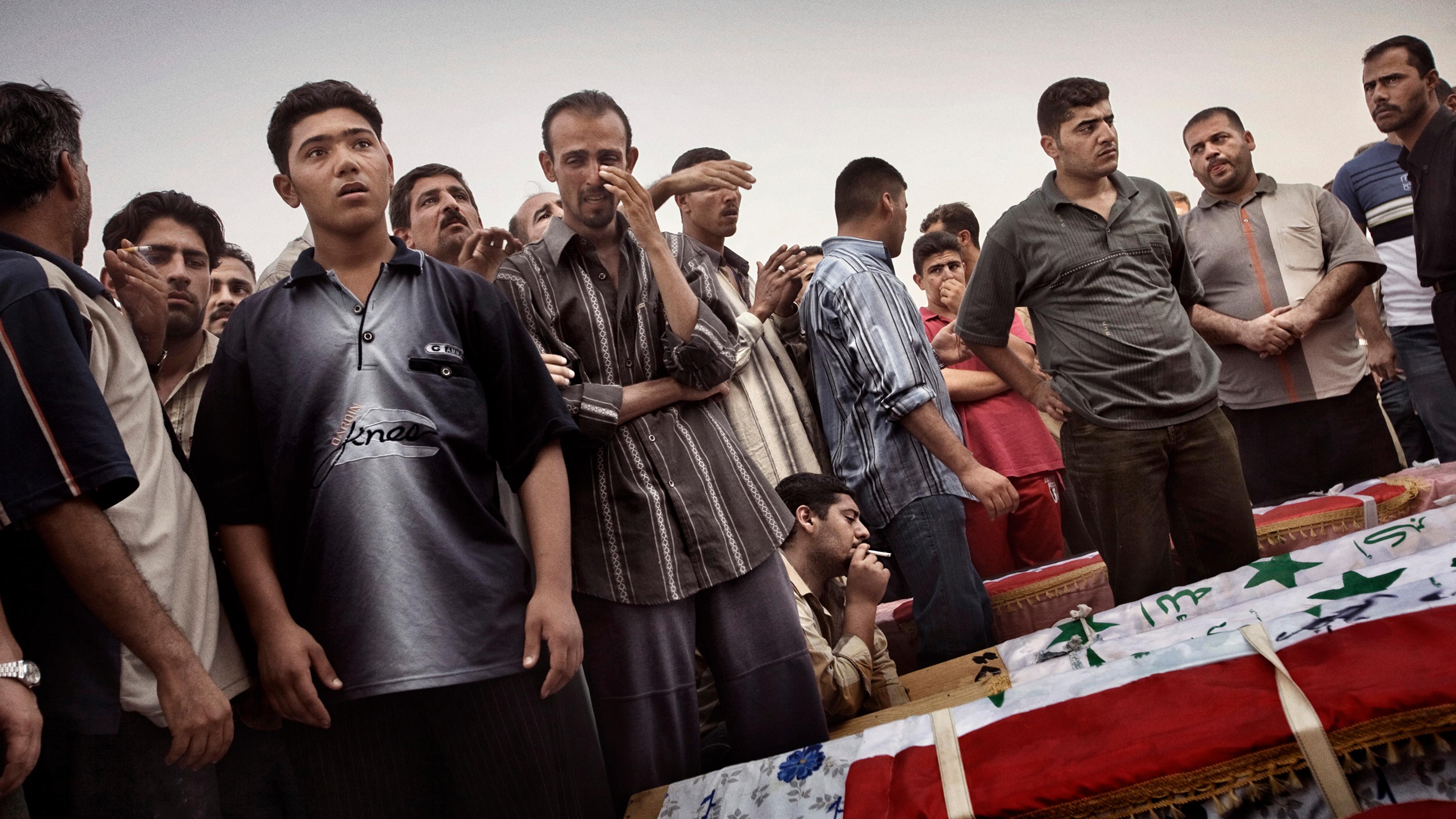 A funeral on Oct 7, 2005, in Baghdad, Iraq, for 22 men who were found handcuffed and shot dead in eastern Iraq. According to family members, the men, mostly Sunni, were taken from their homes by the special forces of the interior ministry, an almost excl