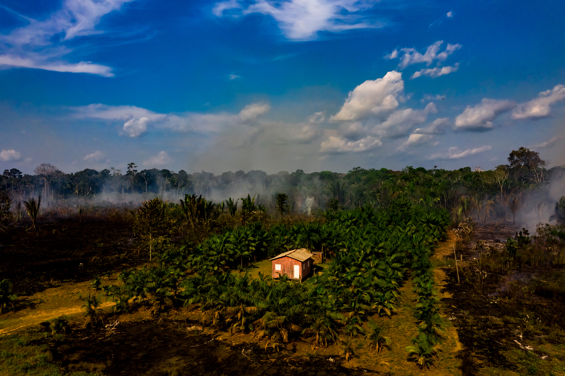Smoke rises from a recent forest fire near the town of Realidade, Brazil, on Aug. 26.