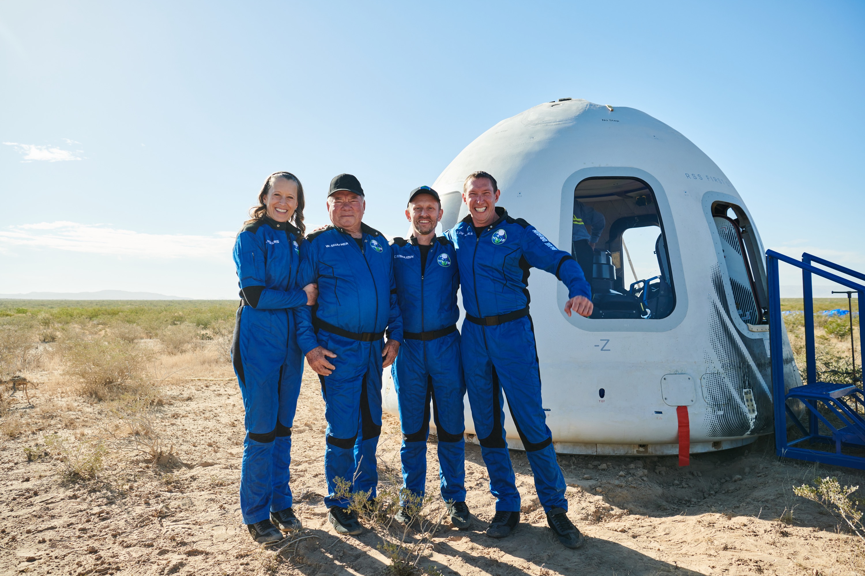 The crew of Blue Origin's  NS-18, from left: Audrey Powers, William Shatner, Dr. Chris Boshuizen, and Glen de Vries), after the capsule landed near Van Horn, Tex. on Oct. 13, 2021 