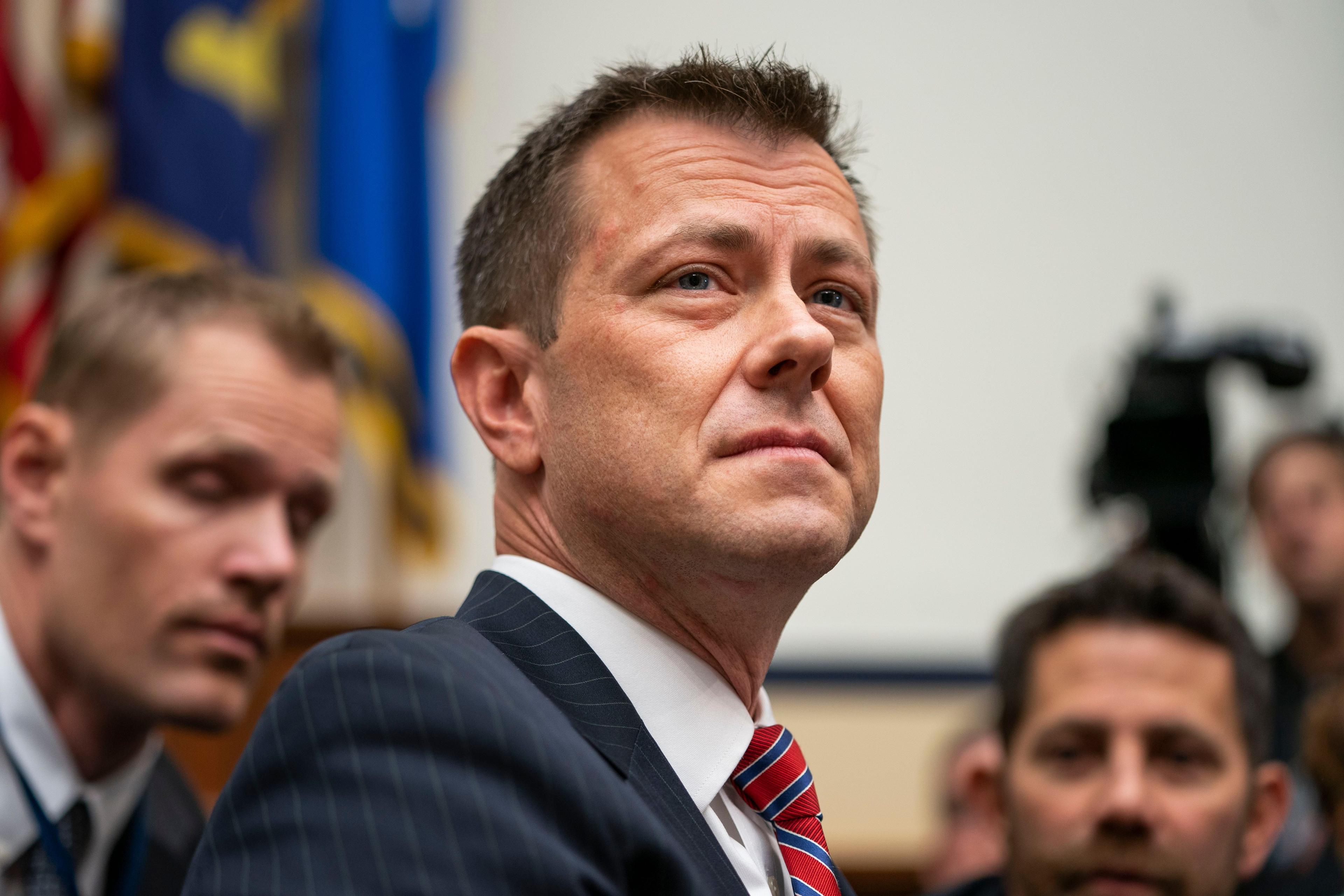 A close-up of Deputy Assistant FBI Director Peter Strzok, looking up as he begins to testify
