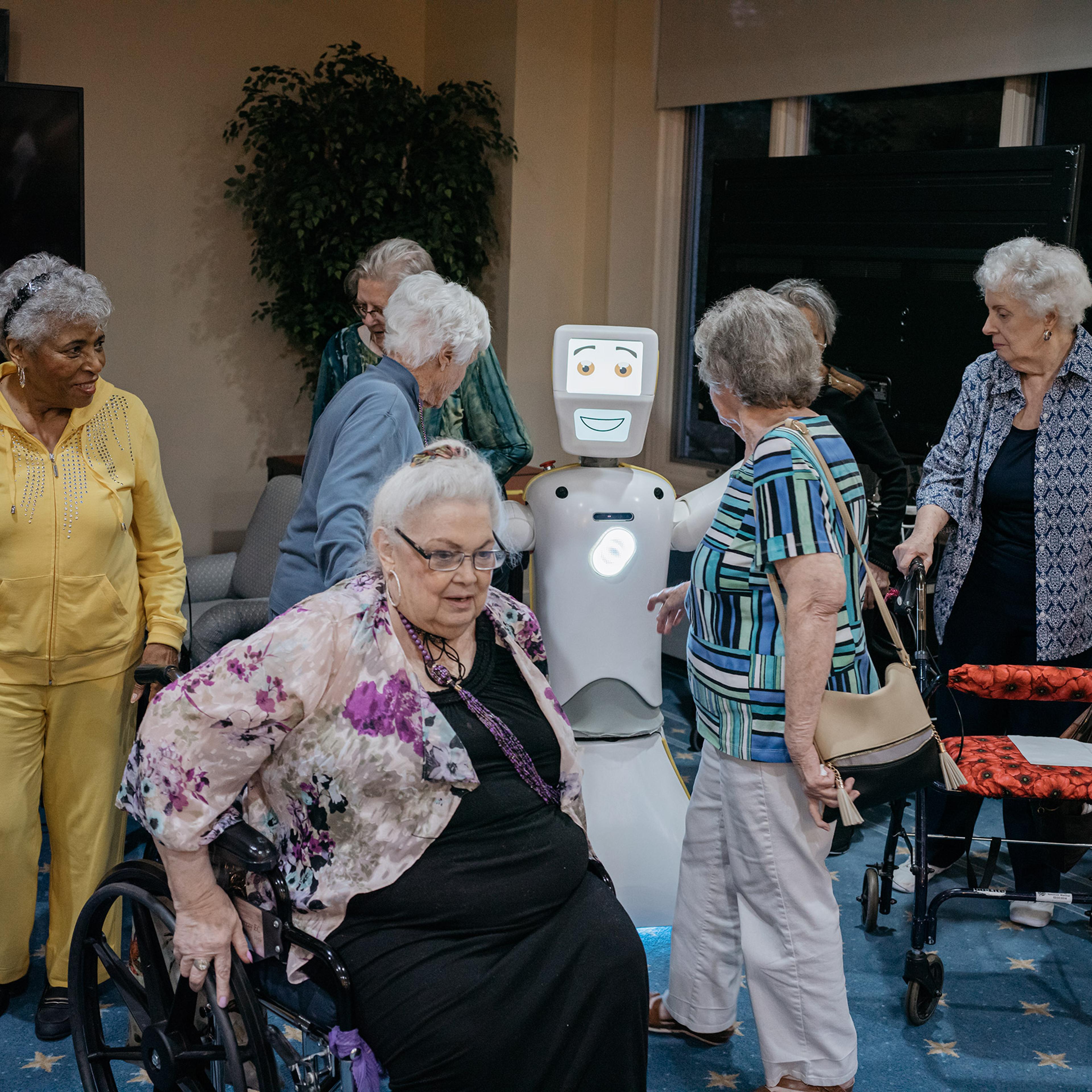 Residents at Knollwood Military Retirement Community in Washington, D.C. gather around Stevie II