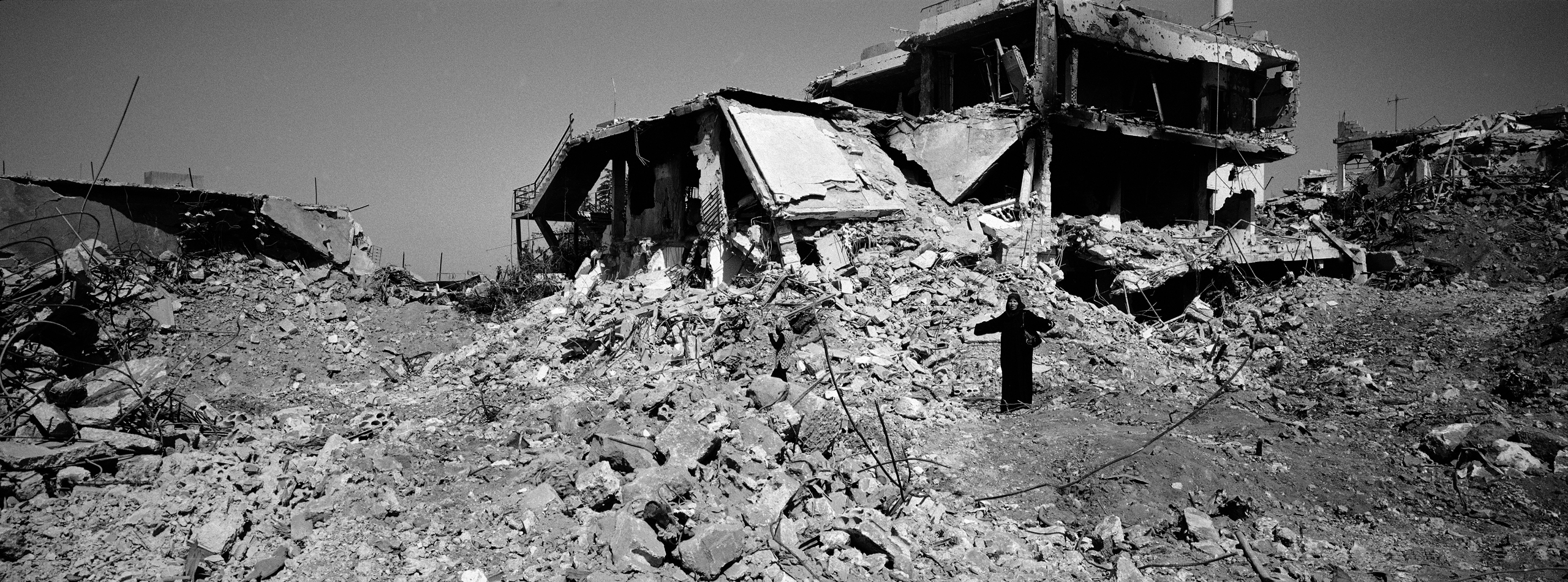 A woman stands in disbelief among the remains of where her house once stood in the village of Aita Chaab, southern Lebanon. It was quite shocking to see how destructive this very short war was between Hezbollah and Israel. The village was first bombed, a