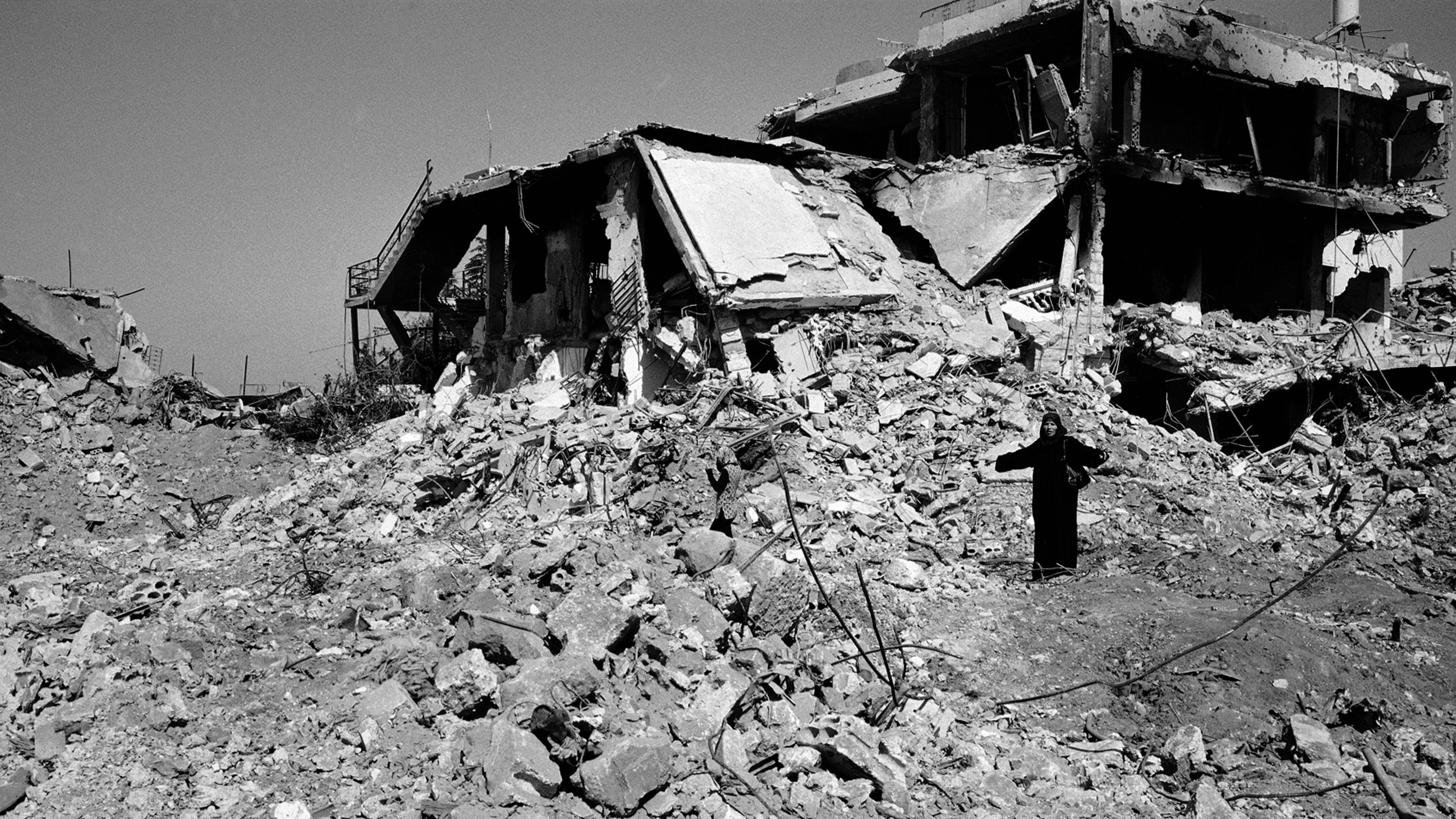 A woman stands in disbelief among the remains of where her house once stood in the village of Aita Chaab, southern Lebanon. It was quite shocking to see how destructive this very short war was between Hezbollah and Israel. The village was first bombed, a