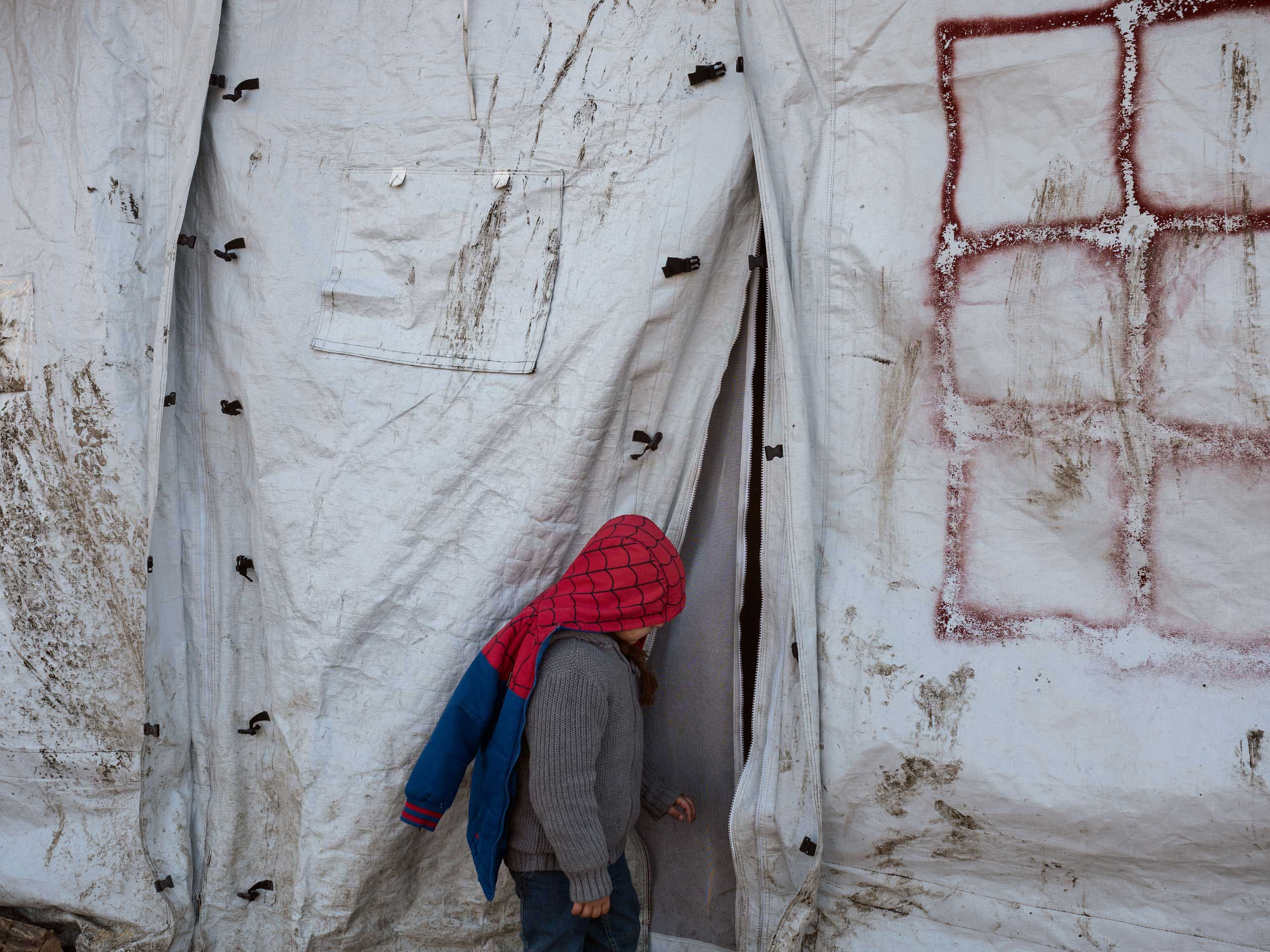A boy wears a spider man jacket at the refugee camp in Grande-Synthe, near Dunkirk, France, which is accommodating over 2,500 refugees mostly families from Kurdistan, Jan. 19, 2016.