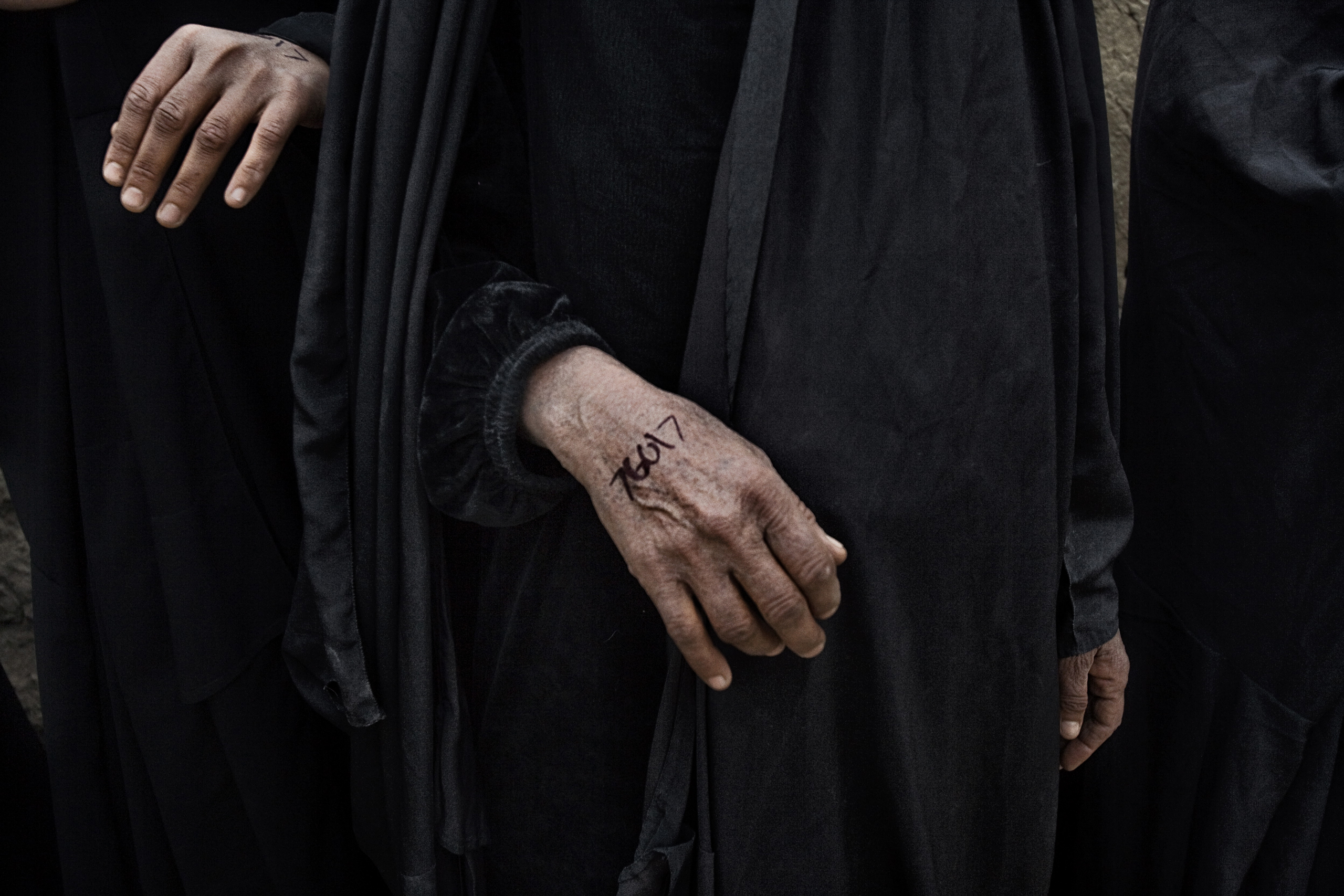 Numbers written on the hand of an Iraqi woman in Qubah, a village in Diyala Province, Iraq, March 24, 2007.