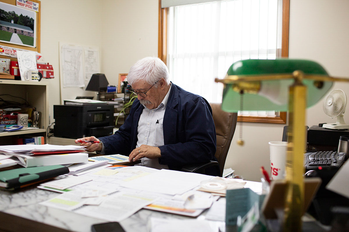 Green Charter Township Supervisor, Jim Chapman, is seen organizing notes and paperwork in his office before the next virtual panel discussion on the proposed Gotion battery plant on Wednesday, April 5, 2023 in Paris, MI.