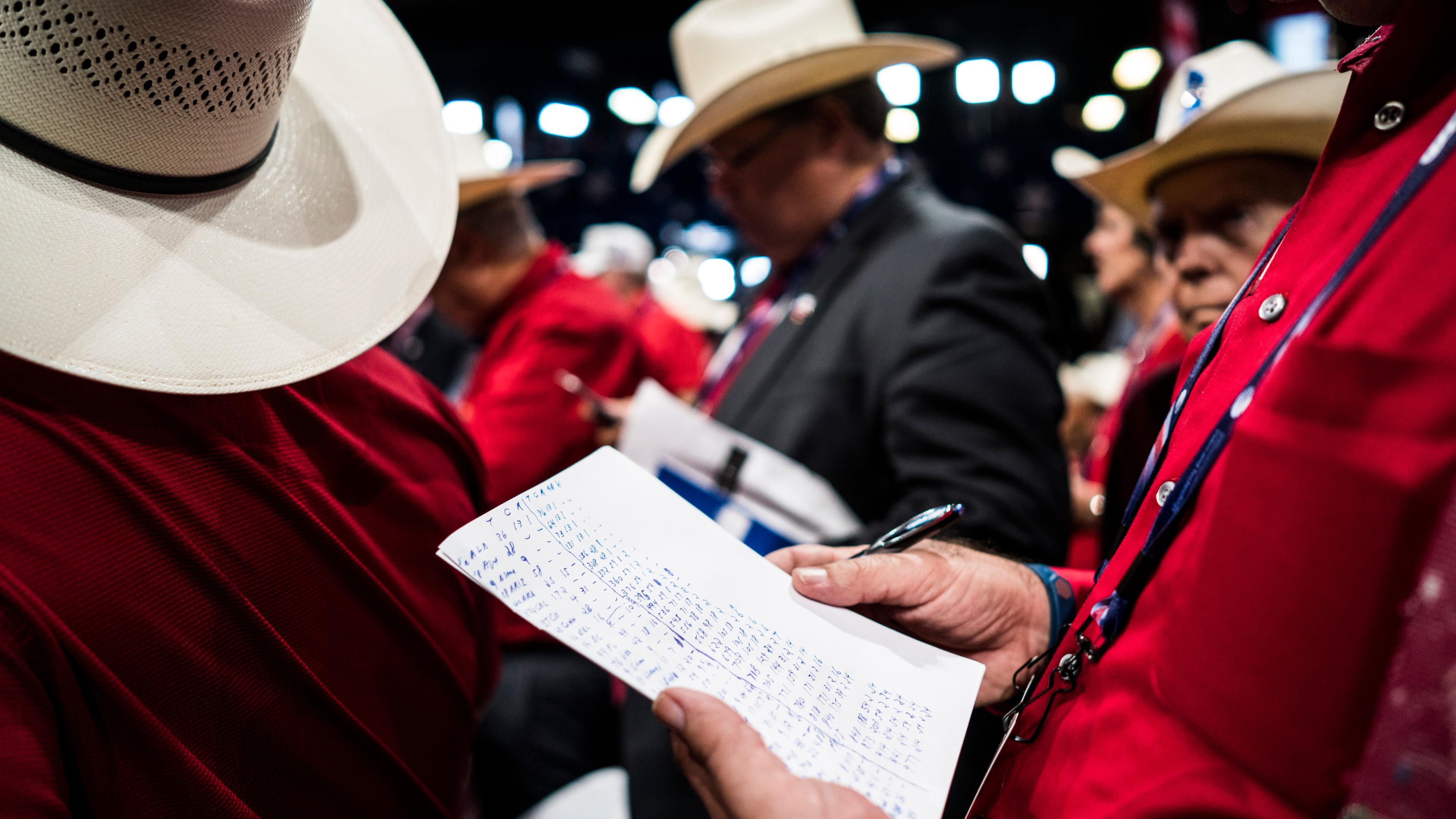 A Texas delegate tallies up the votes for the Donald Trump's nomination at the Republican National Convention in Cleveland on Tuesday, July 19, 2016.