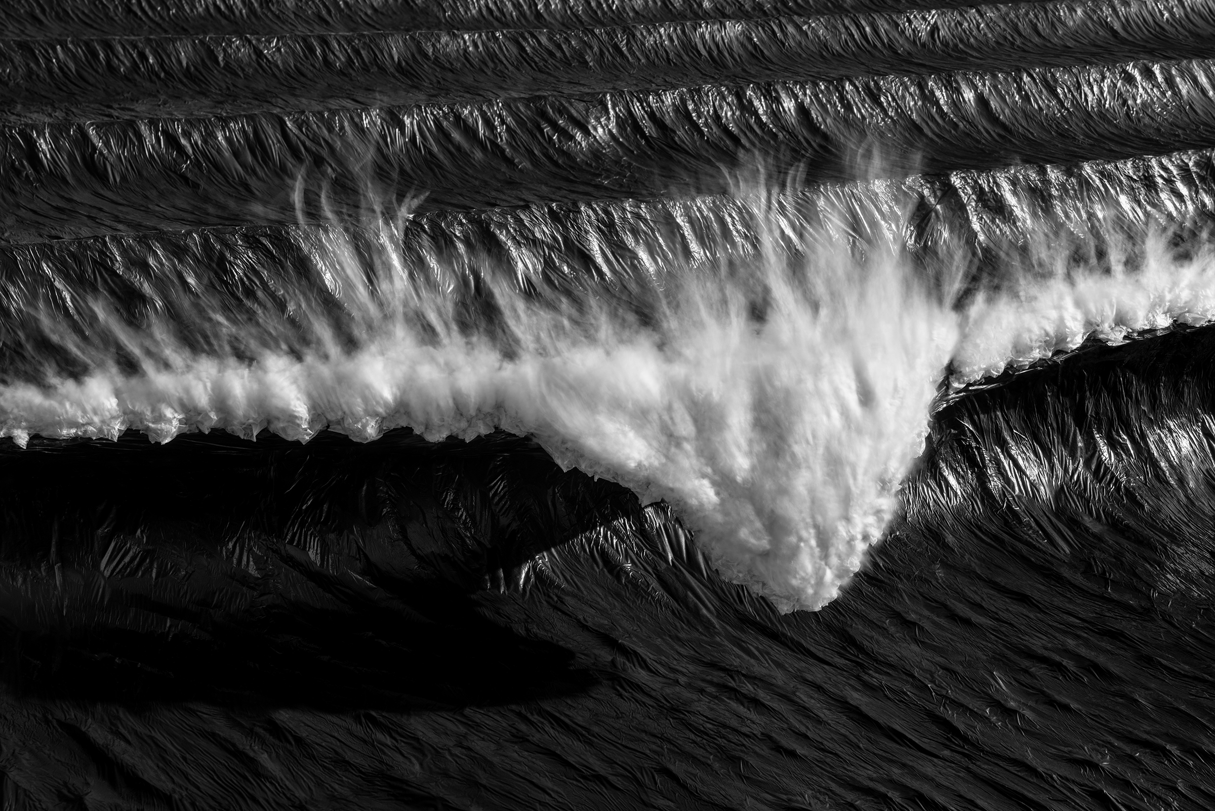 Photo of a wave sculpture crafted out of recycled materials