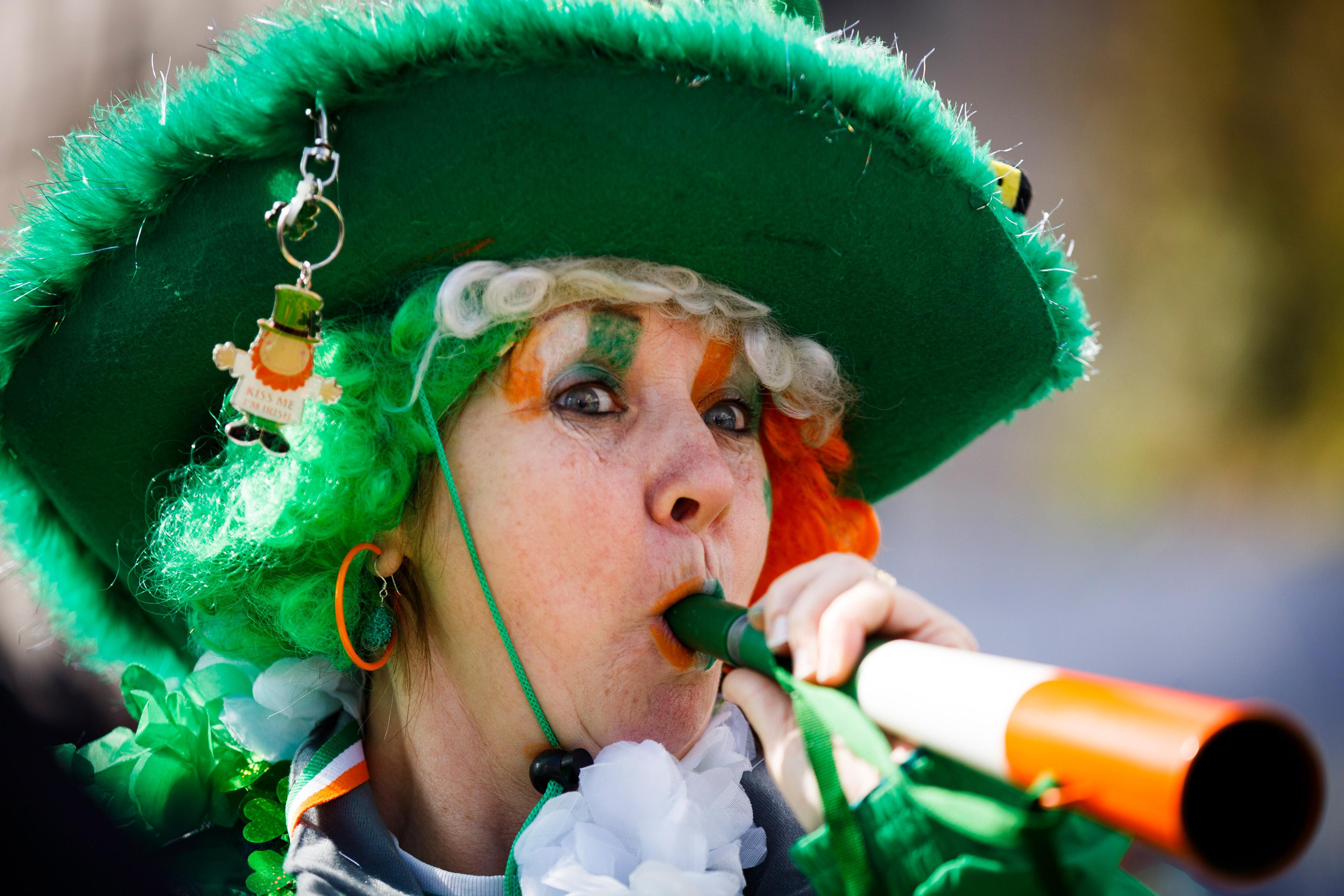 A woman takes part in the St Patrick's Day parade through central London, March 13, 2016.