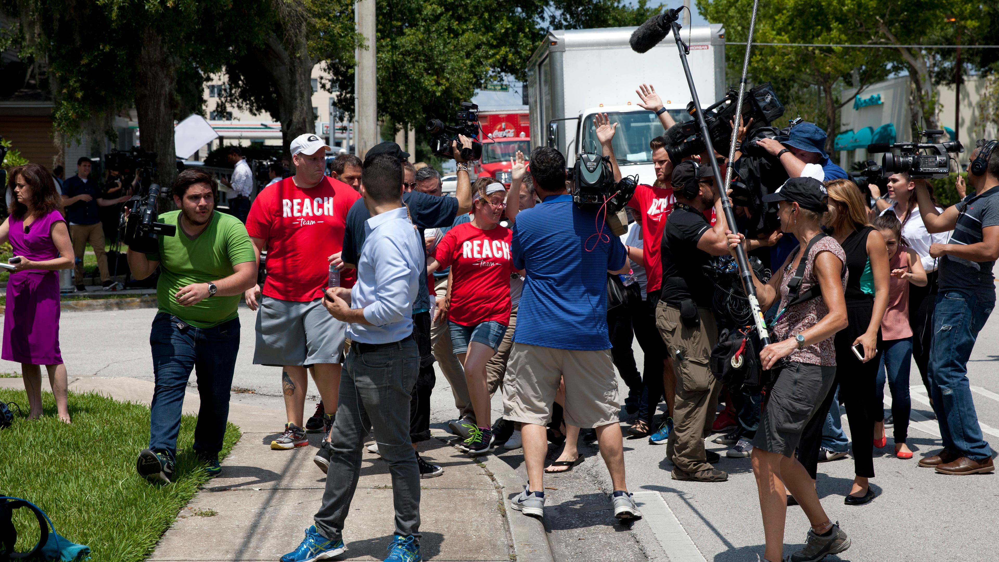 Reporters wait to interview relatives of victims of the Pulse nightclub shooting in Orlando, Fla., on June 13, 2016.