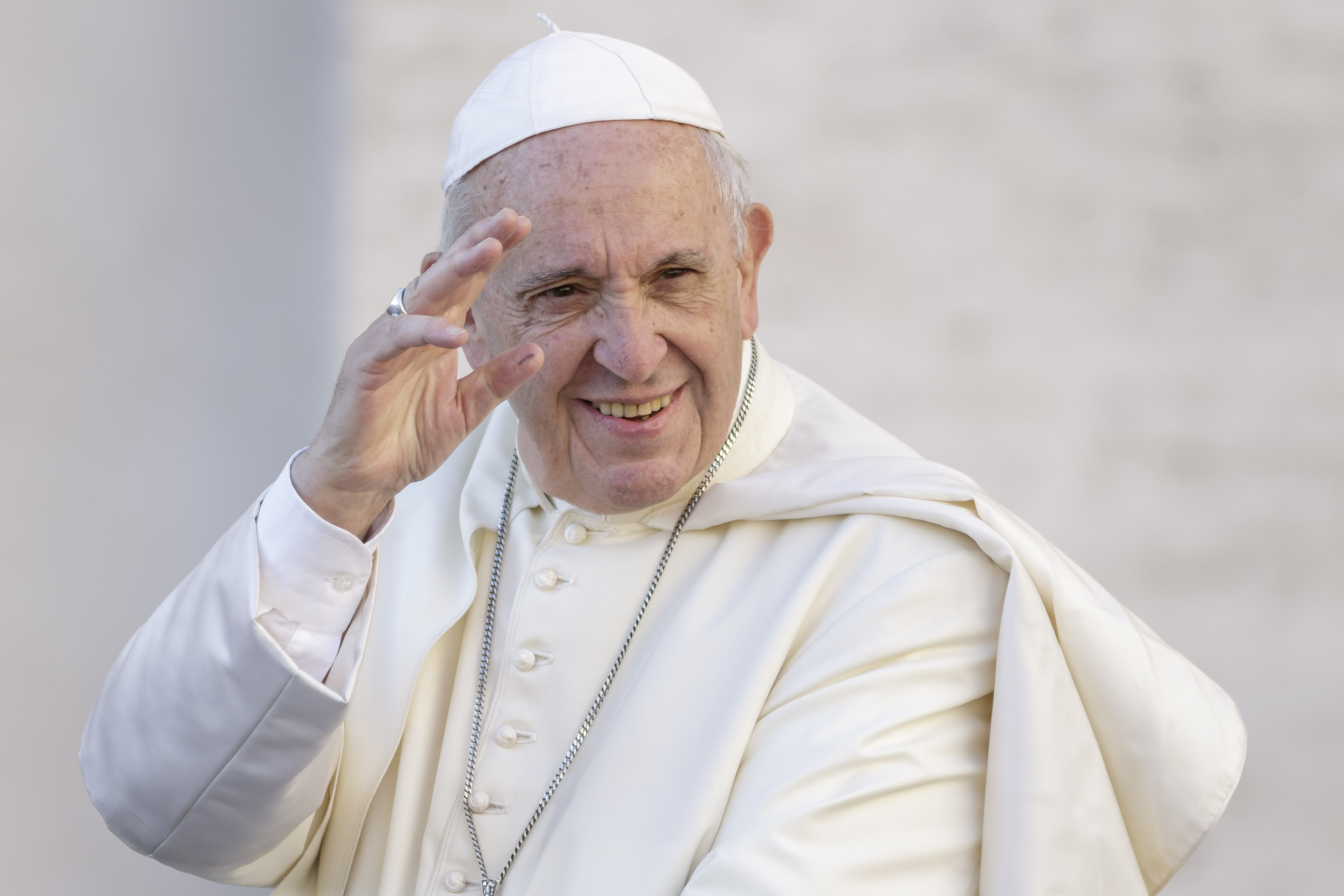 Pope Francis greets the faithful as he arrives to celebrate