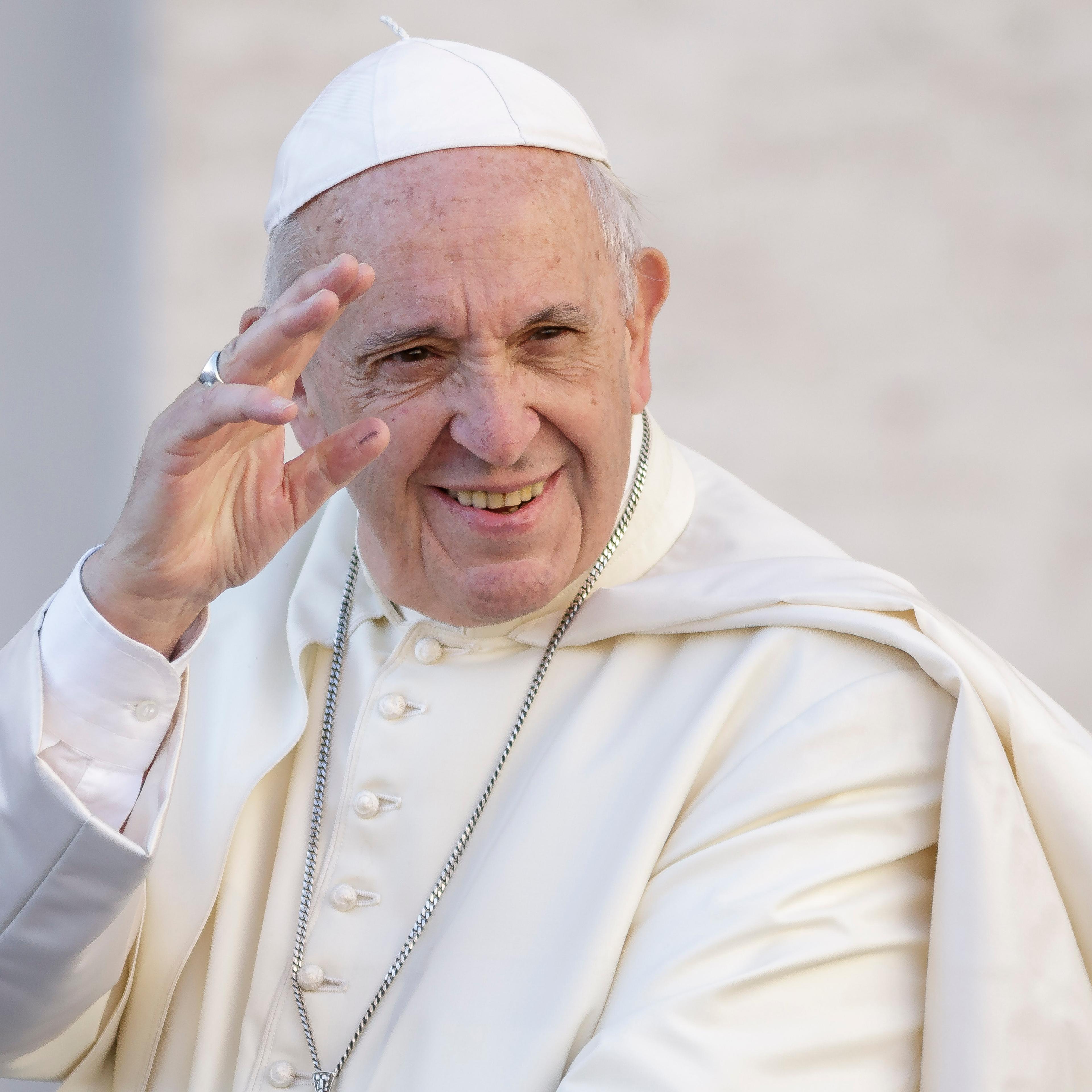 Pope Francis greets the faithful as he arrives to celebrate