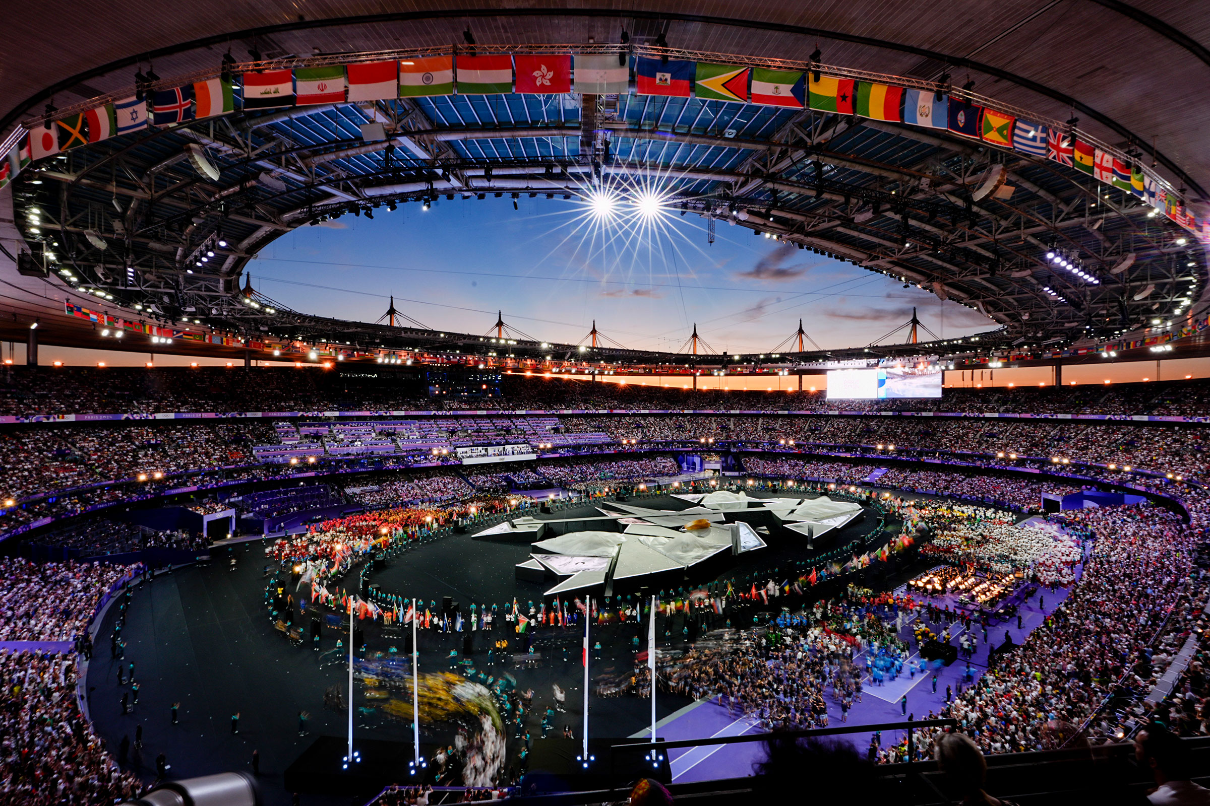 Athletes file into the arena during the closing ceremony for the Paris 2024 Olympic Summer Games at Stade de France on Aug. 11, 2024.