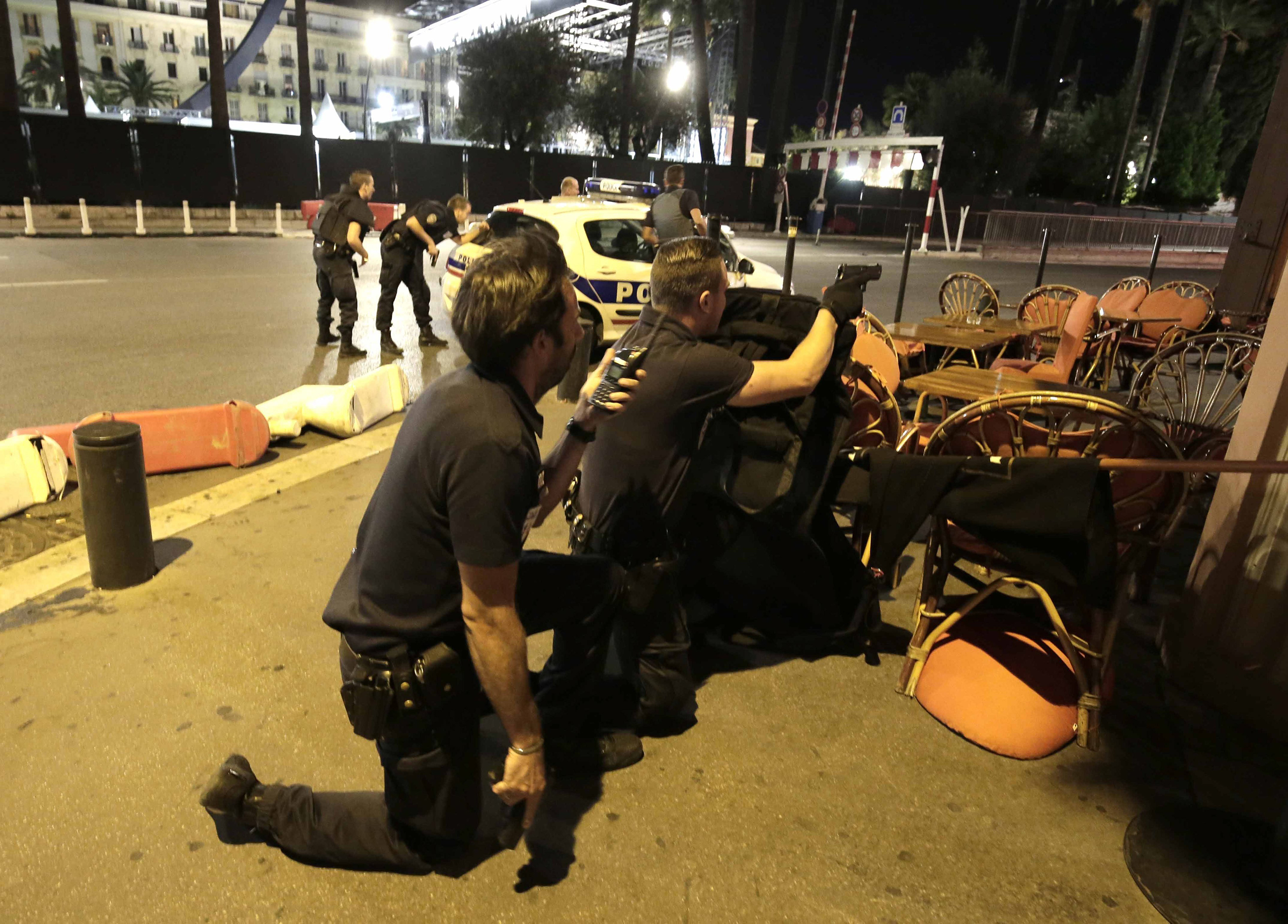 Police officers respond to reports of a truck slamming into a crowd in Nice, France, on July 14, 2016.