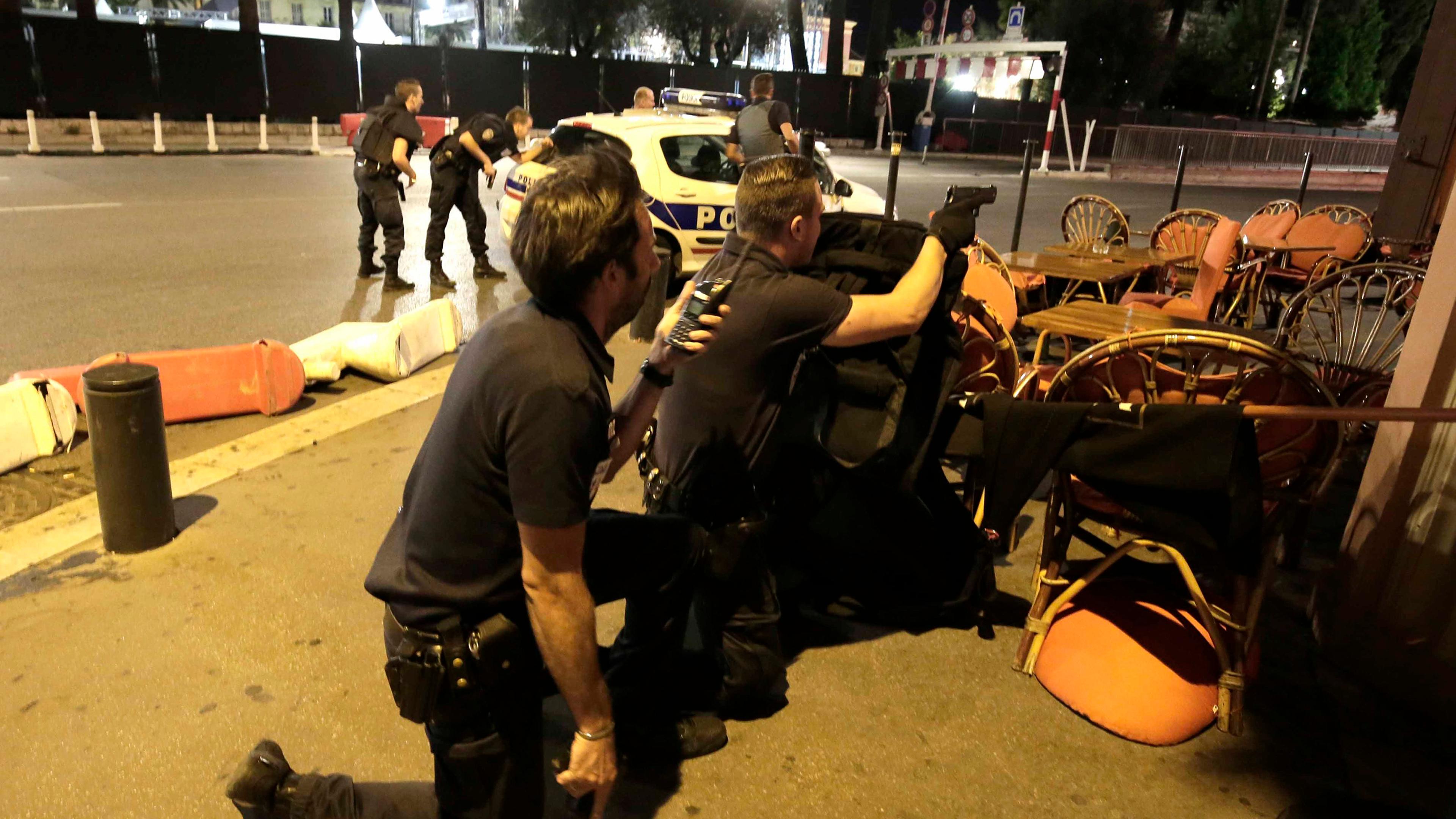 Police officers respond to reports of a truck slamming into a crowd in Nice, France, on July 14, 2016.