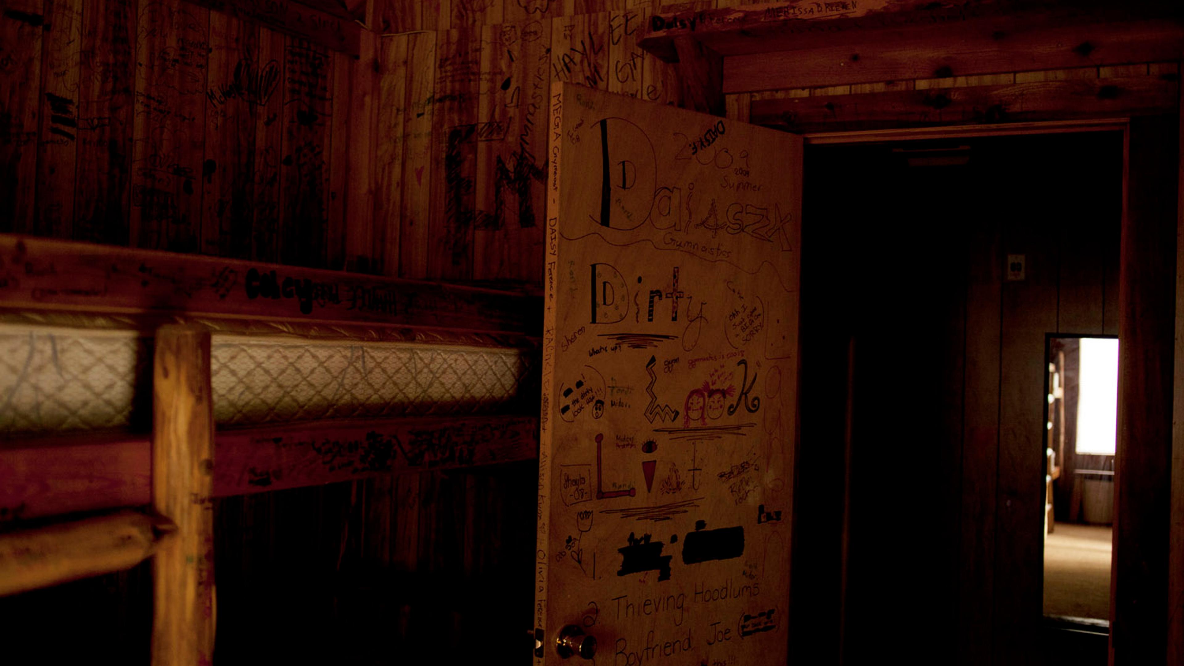 Graffiti in the cabins where young visiting gymnasts stay.