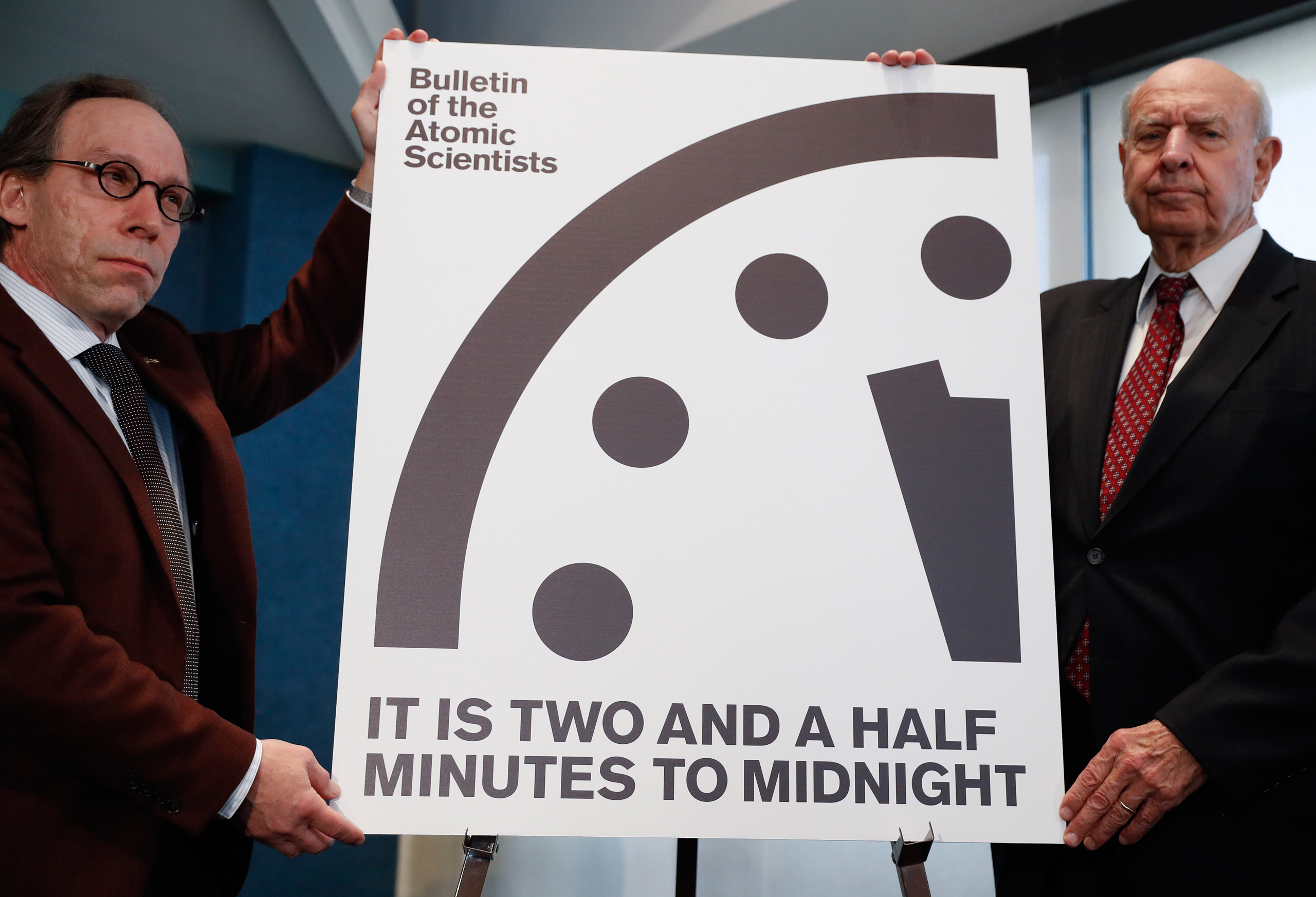 Lawrence Krauss, theoretical physicist, chair of the Bulletin of the Atomic Scientists Board of Sponsors, left, and Thomas Pickering, co-chair of the International Crisis Group, display the Doomsday Clock during a news conference the at the National Pres