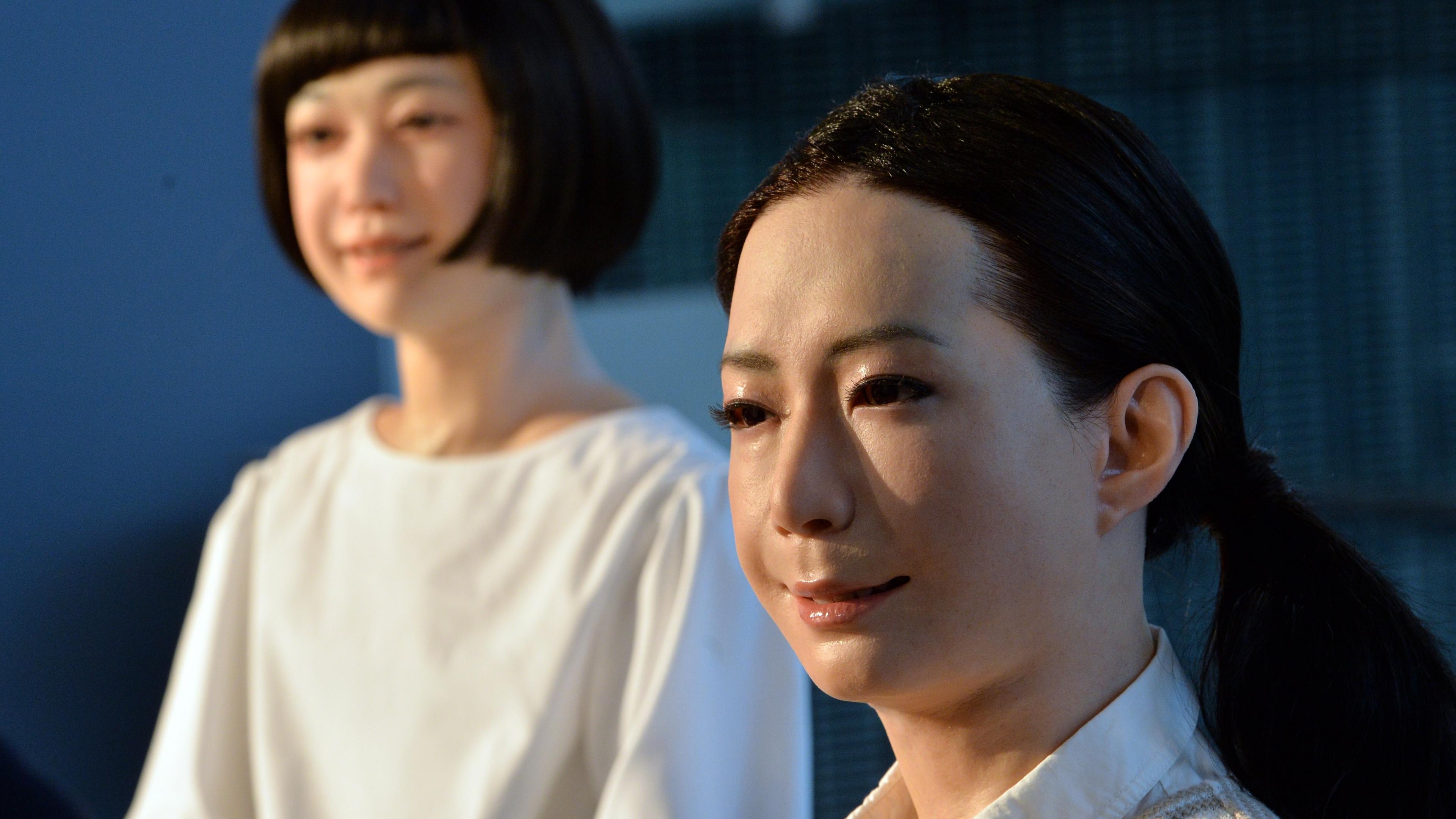 The new humanoid robots named "Otonaroid" and "Kodomoroid" are pictured during a press preview at the National Museum of Emerging Science and Technology in Tokyo on June 24, 2014.