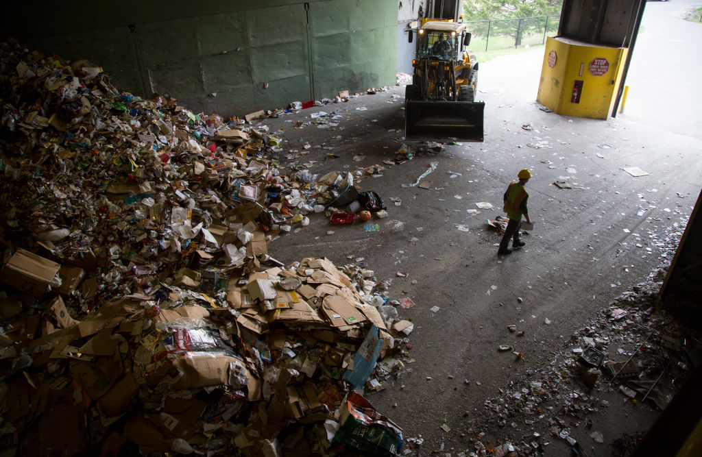 A worker leaves an Ecomaine recycling facility