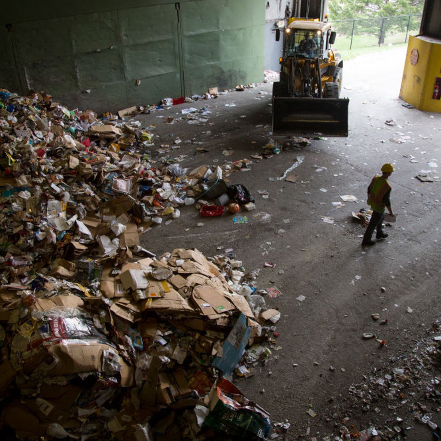 A worker leaves an Ecomaine recycling facility