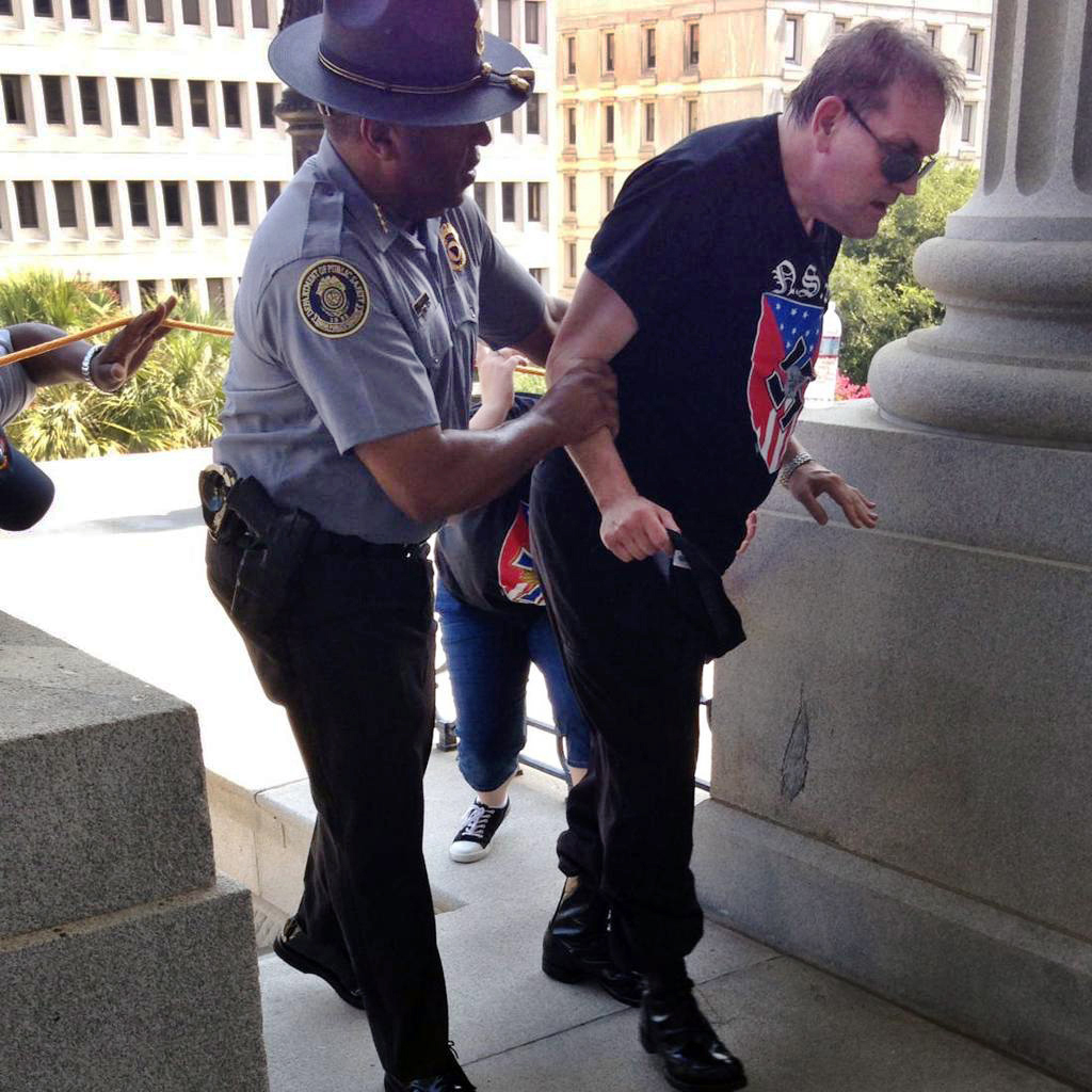 See the Moving Photo of a Black Cop Helping a Man at KKK Rally
