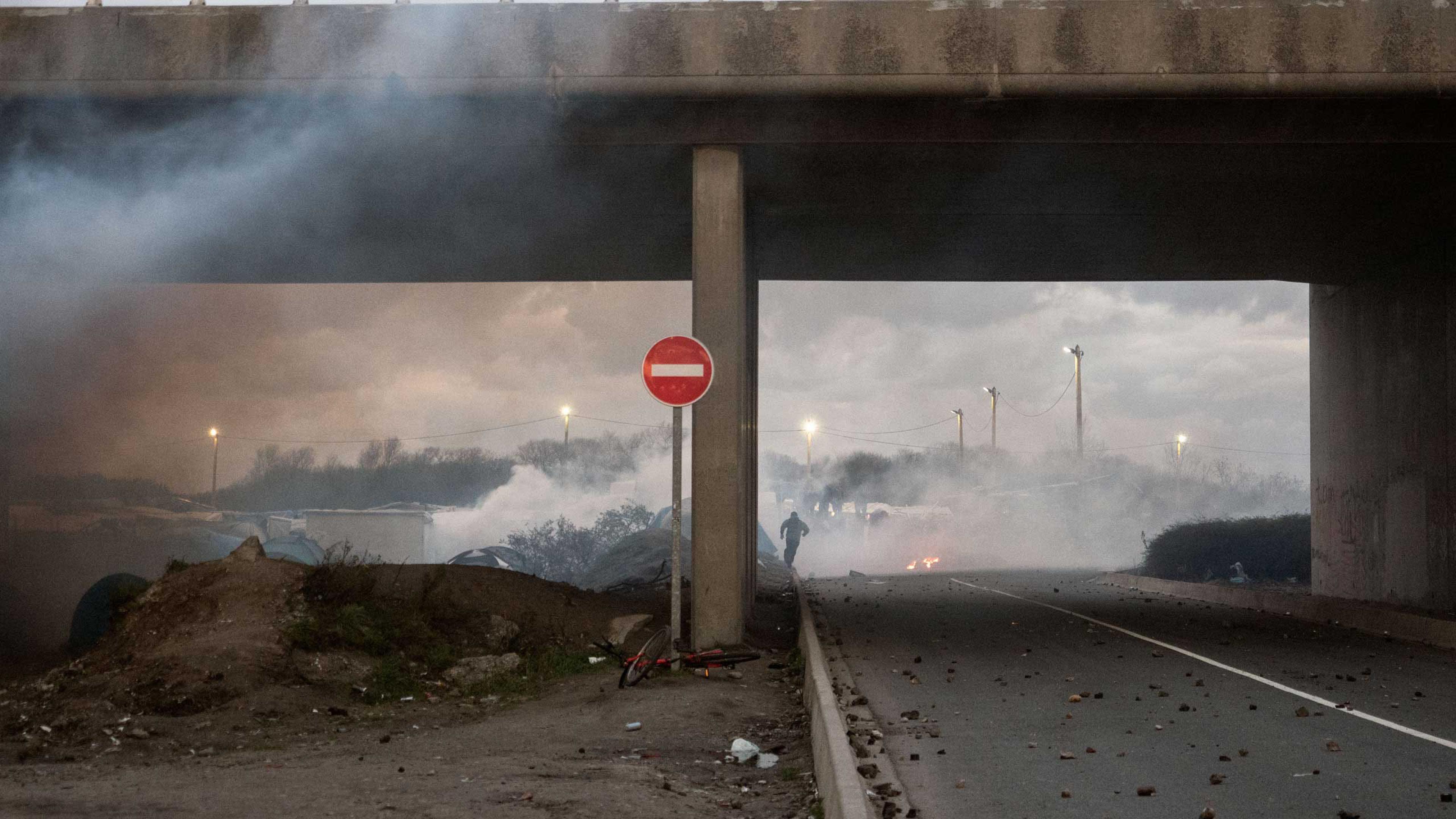 A clash between migrants and police in Calais, France, Nov. 25, 2015, where a mix of refugees, asylum seekers and economic migrants from Darfur, Afghanistan, Syria, Iraq, and Eritrea live in the shantytown known as the Òjungle."