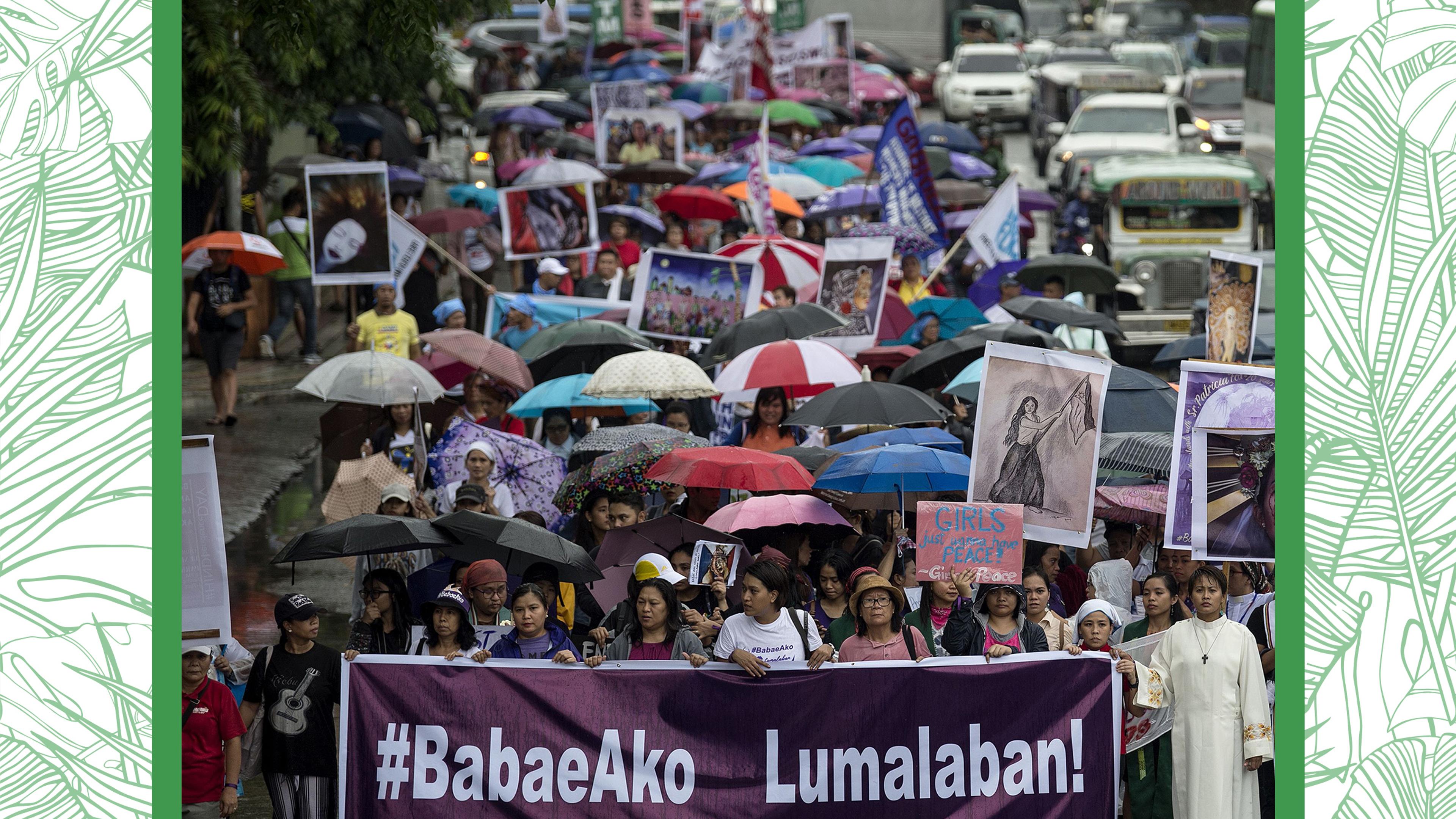 Female protesters march on the streets of Manila on Independence Day.