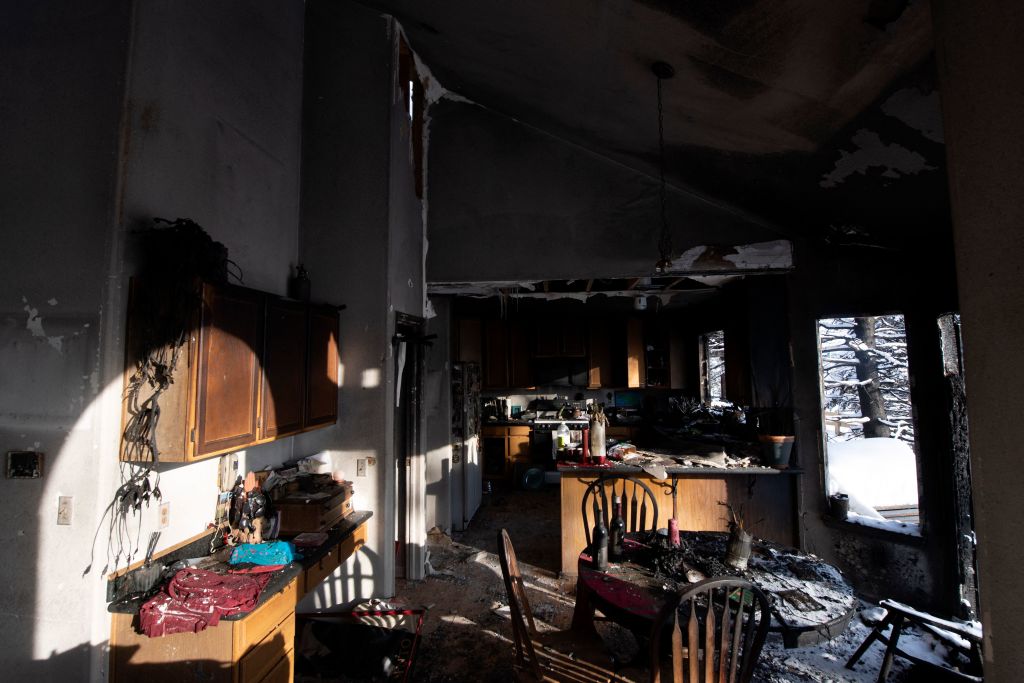 Sunlight illuminates the walls of a residence destroyed by the Marshall Fire in the Rock Creek neighborhood of Superior in Boulder County, Colorado on January 1, 2022.