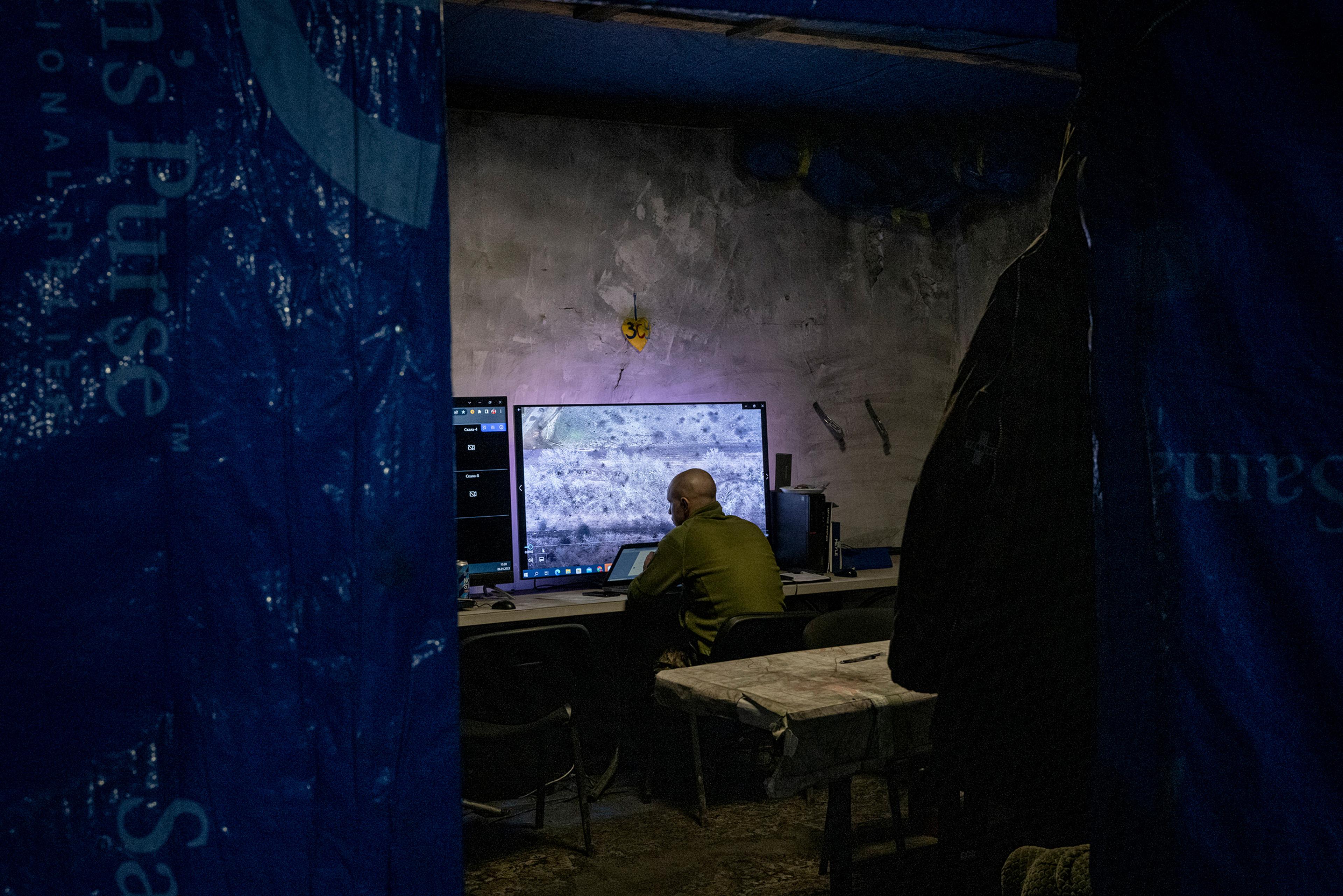 A Ukrainian military analyst reviews videos obtained by drone operators near Bakhmut in Jan. 2023.