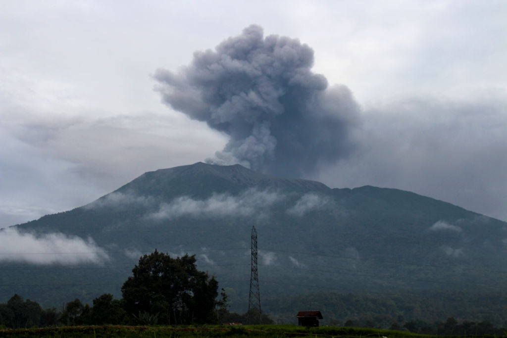 Volcanic ash spews from Mount Marapi during an eruption as seen from Batu Palano village in Agam on Dec. 4, 2023.